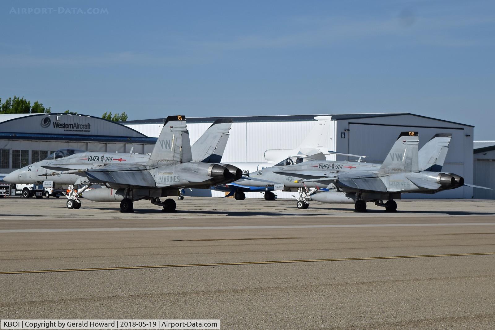 Boise Air Terminal/gowen Fld Airport (BOI) - Two F/A-18s from VMFA-314 “Black Knights”, NAS Miramar, CA parked on the sough GA ramp.
