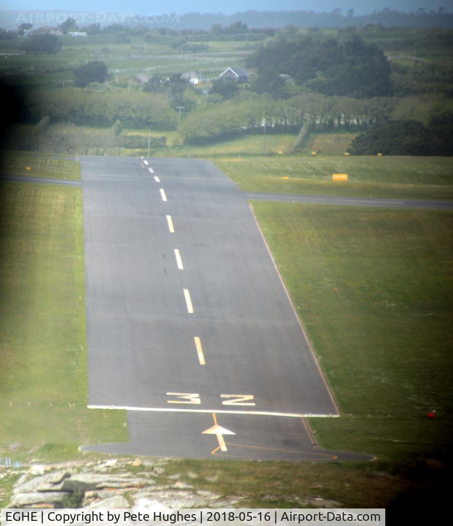 St. Mary's Airport, St. Mary's, England United Kingdom (EGHE) - Short finals for 32 St Marys Isles of Scilly in Twin Otter G-CEWM.  Since my 1987 pictures (qv) the grass has been replaced by tarmac runway.  The slope here is quite apparent, see also the shots at ground level from the threshold.