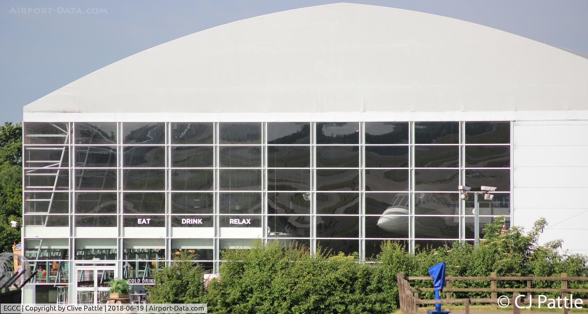Manchester Airport, Manchester, England United Kingdom (EGCC) - The preserved BAe Concorde G-BOAC just visible in its own hangar at the Runway Visitor Centre at Manchester Airport