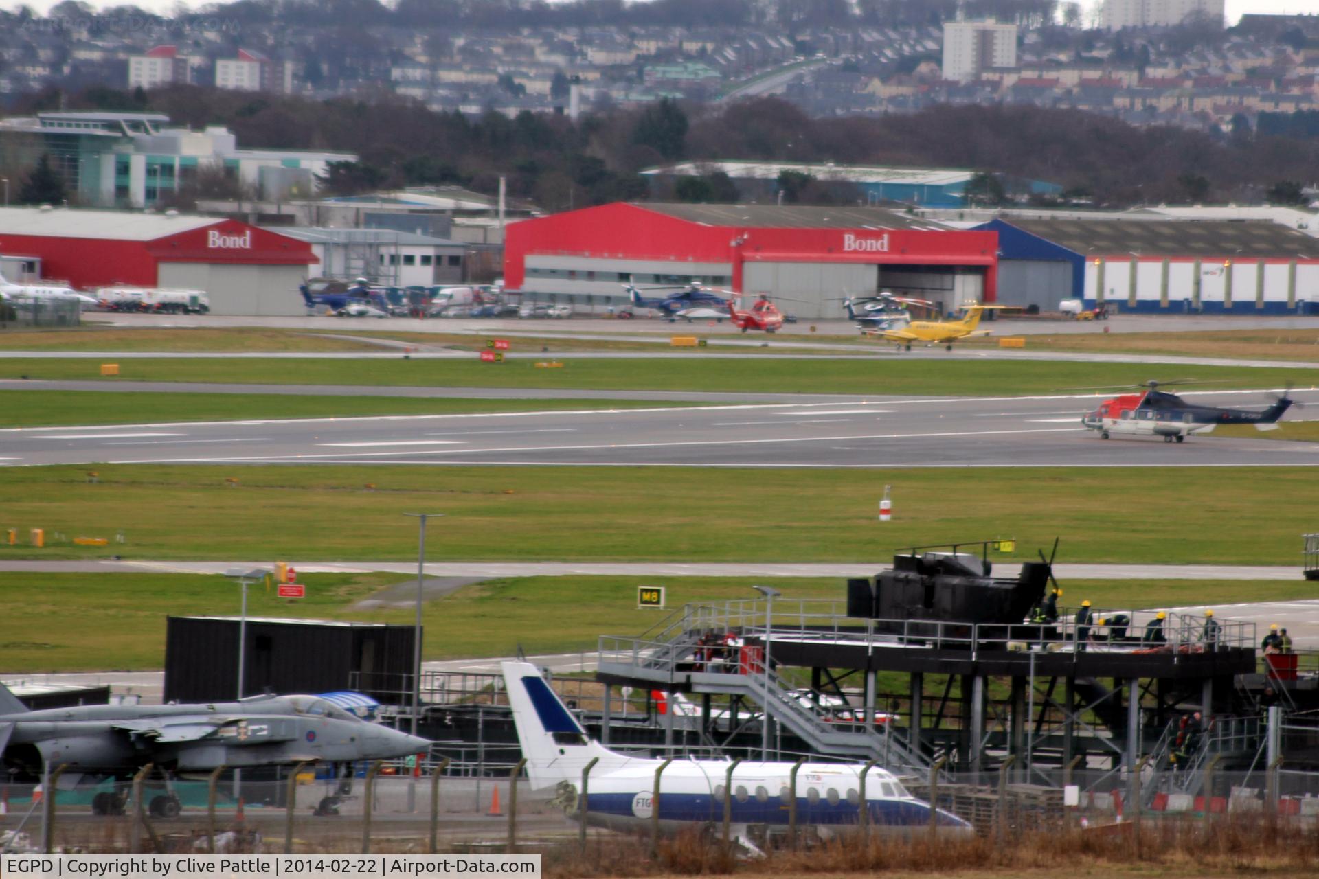 Aberdeen Airport, Aberdeen, Scotland United Kingdom (EGPD) - Airport view - Fire training area in the foreground with BAe Jetstream T.2 and Sepecat Jaguar on show.