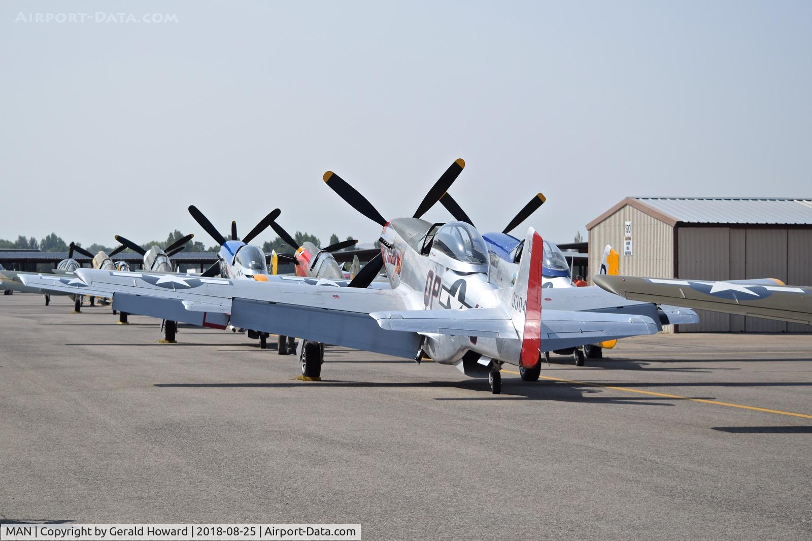 Nampa Municipal Airport (MAN) - P-51 & P-40 aircraft parked on airshow ramp.