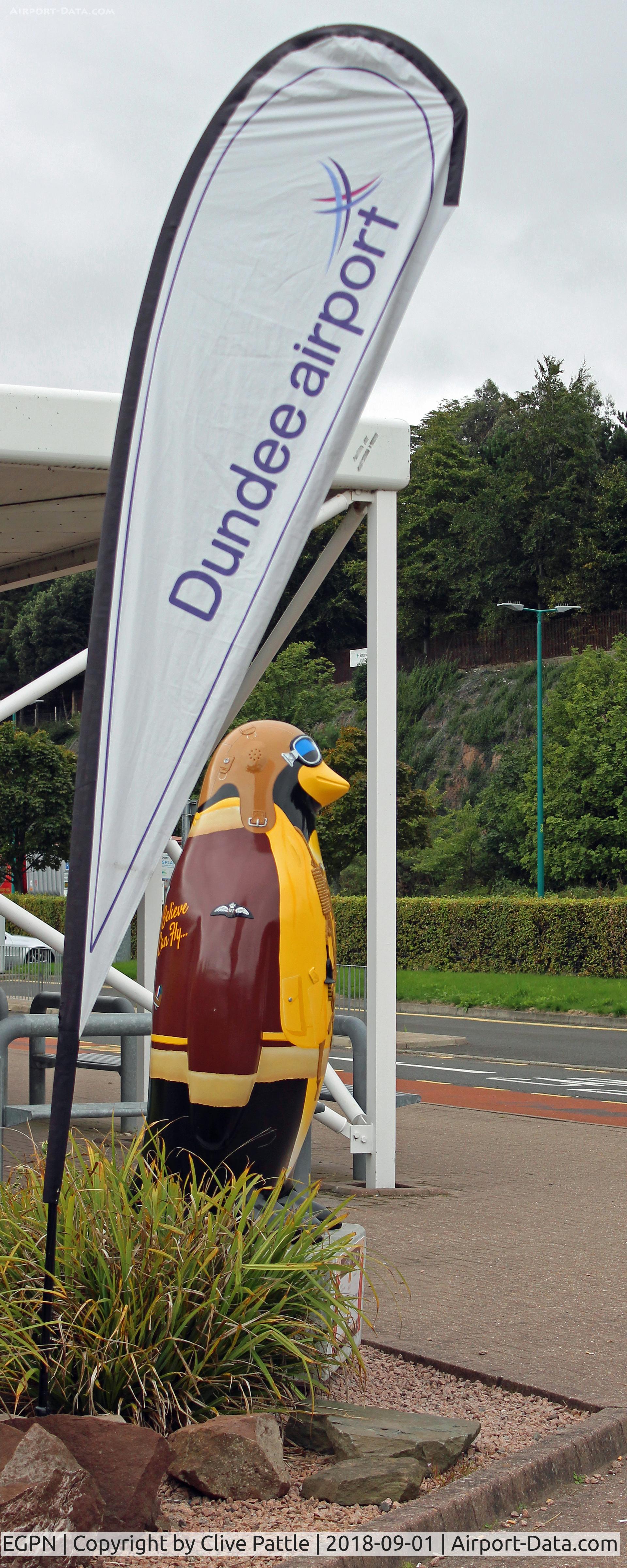 Dundee Airport, Dundee, Scotland United Kingdom (EGPN) - The 'I Believe I Can Fly' Charity Penguin Statue at the entrance to Dundee Airport. Over 80 such penguins, in various paint schemes have been placed in and around local landmarks in the Dundee and County of Angus areas. Children have to find them.