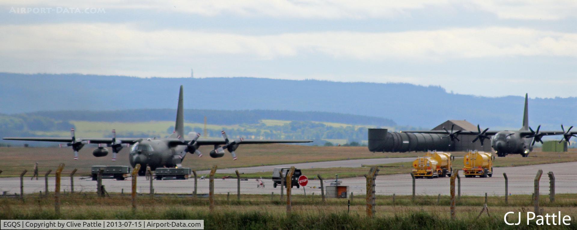 RAF Lossiemouth Airport, Lossiemouth, Scotland United Kingdom (EGQS) - Two RAF Hercules taxy on the airfield