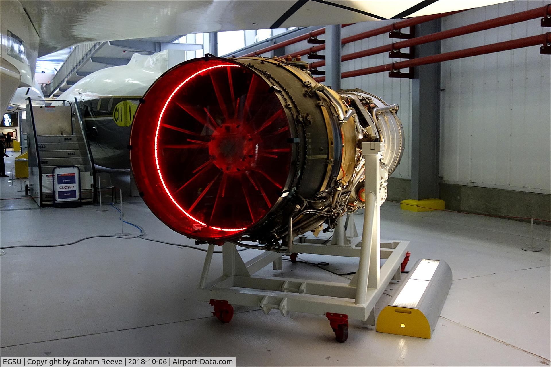 Duxford Airport, Cambridge, England United Kingdom (EGSU) - Rolls Royce Olympus engine under the wing of a Concorde, at IWM Duxford.