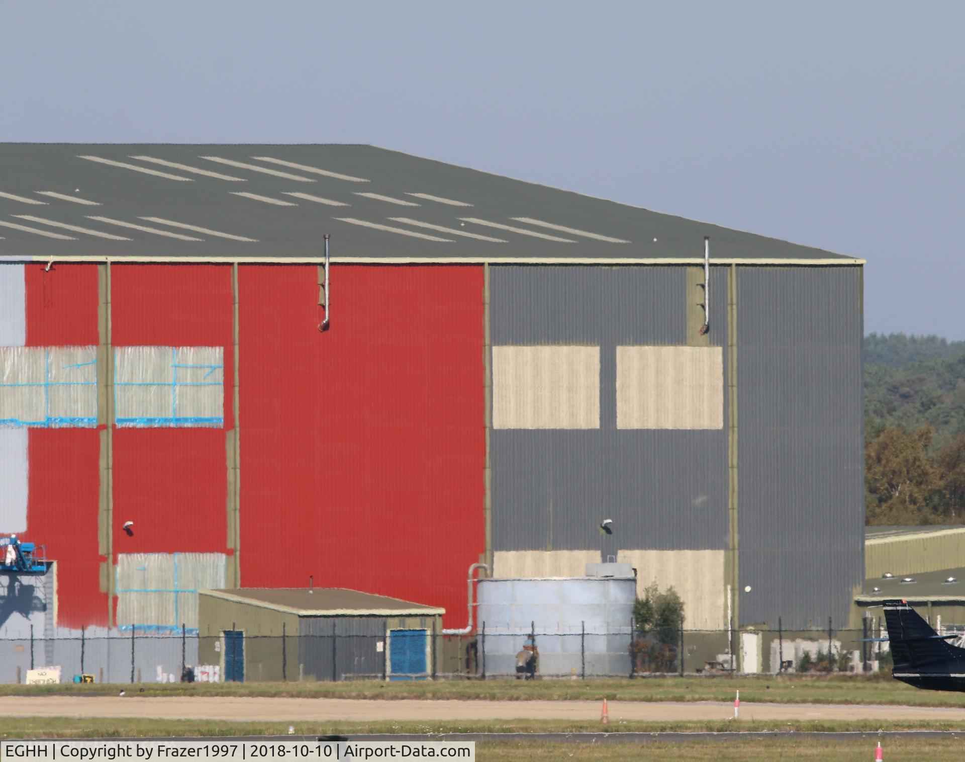 Bournemouth Airport, Bournemouth, England United Kingdom (EGHH) - The Large hanger at Bournemouth previously used to store the 747'8 BBJVQ-BSK being painted for the new owners GAMA Aviation. 