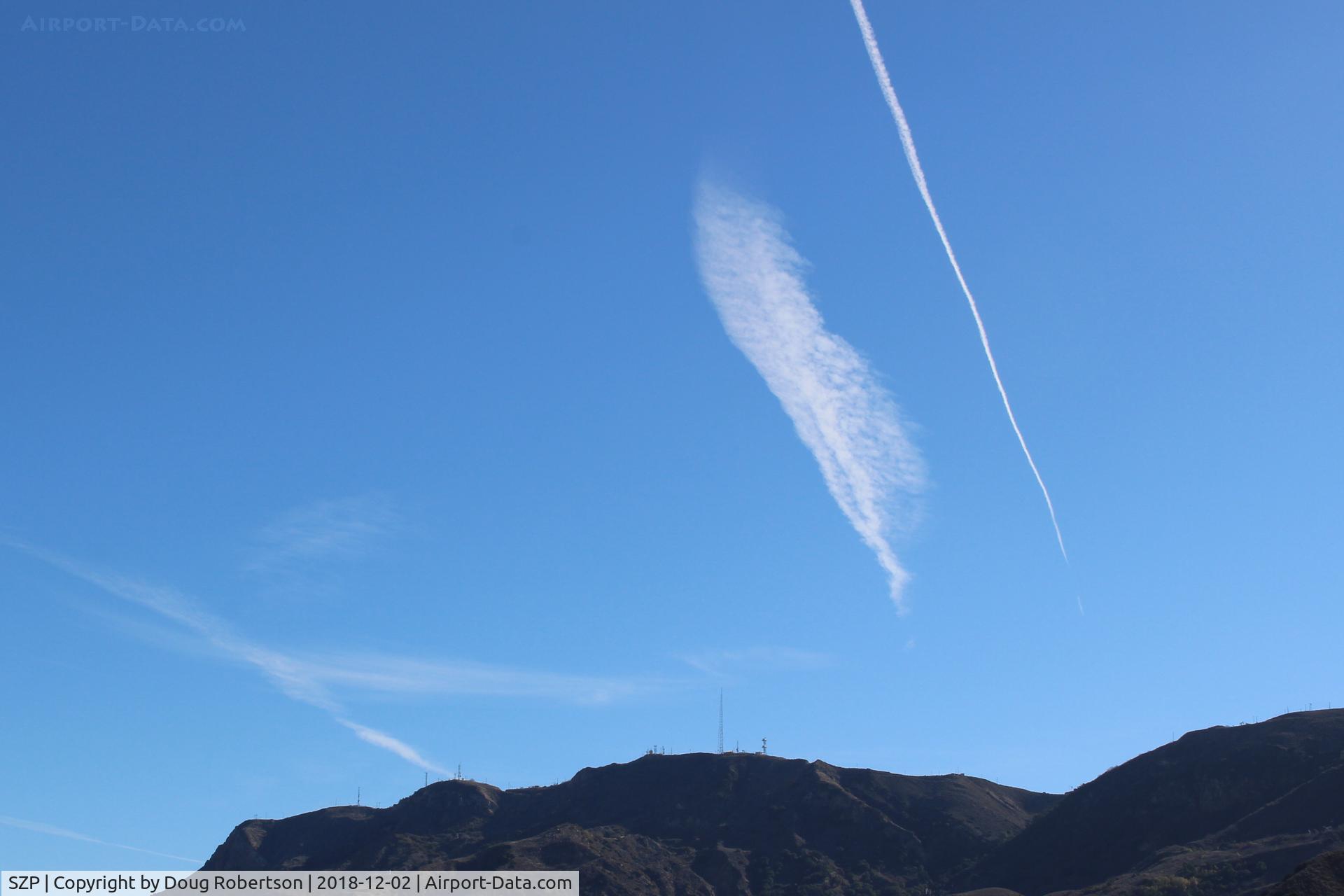 Santa Paula Airport (SZP) - Jet contrails over South Mountain of passenger jets enroute south-east bound to KLAX, Los Angeles International Airport