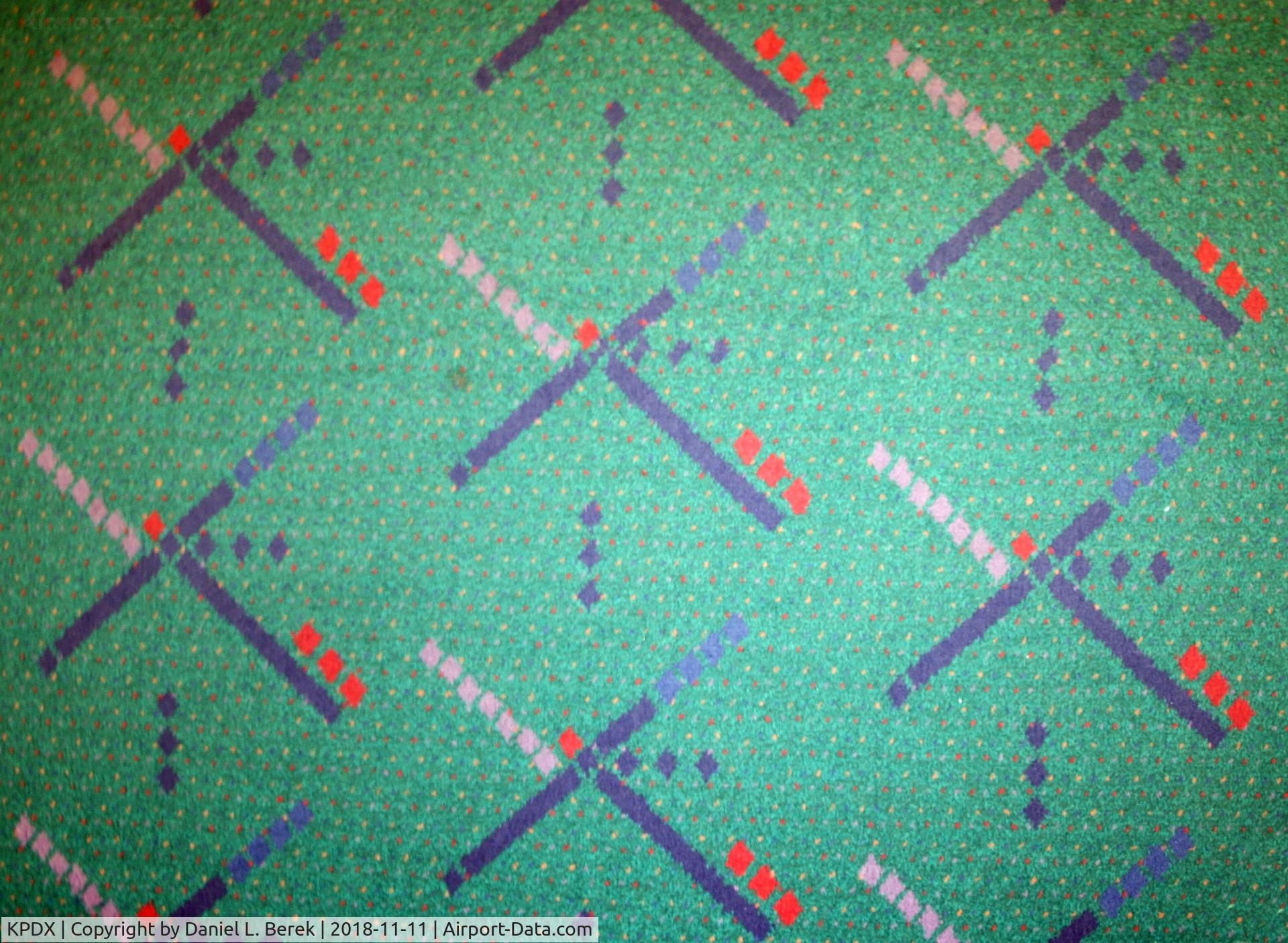 Portland International Airport (PDX) - The beautiful carpet design from the early 1980s is a destination unto itself. Most of the airport has been renovated with a more modern design, but a small area survives in the A wing... for now.