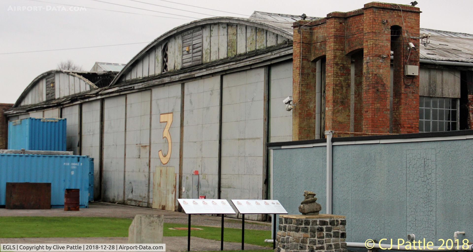 Old Sarum Airfield Airport, Salisbury, England United Kingdom (EGLS) - A WWII hangar at Old Sarum. In the foreground is the AOP memorial commemorating the numerous AOP Sqdns that operated from the base.