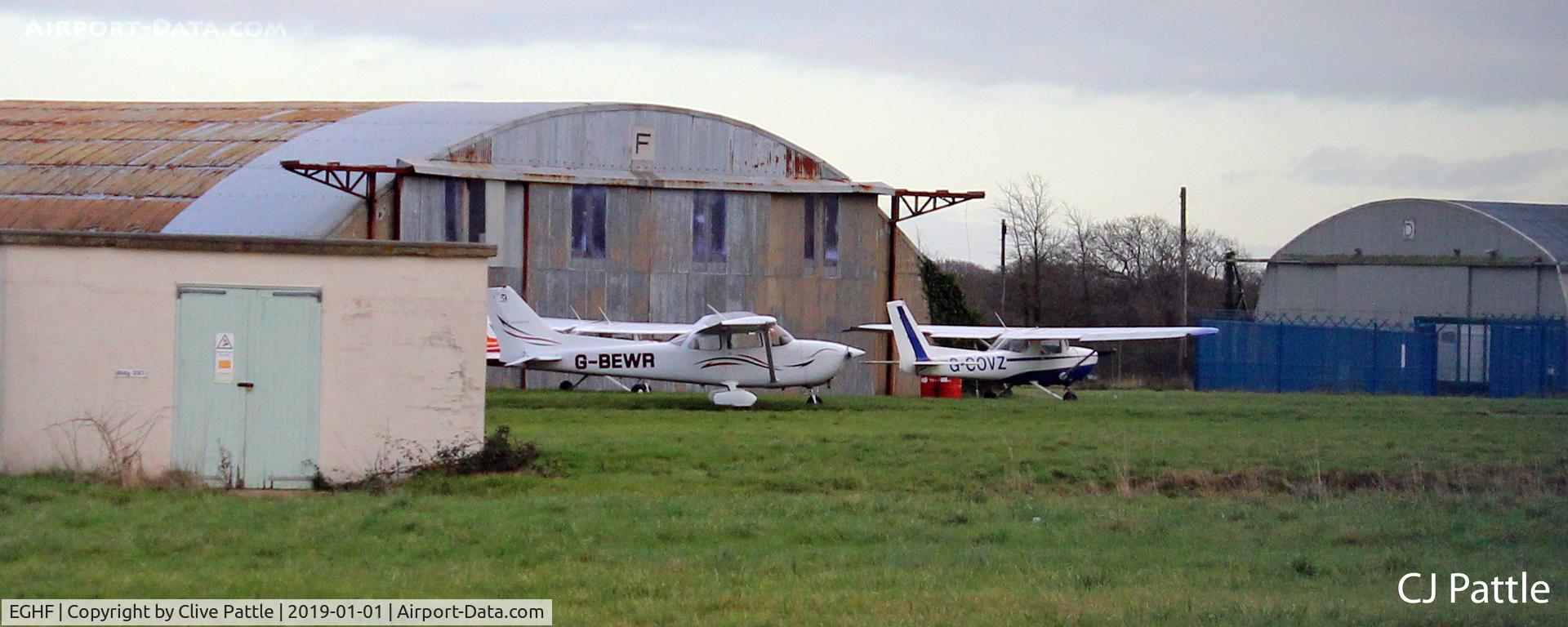 EGHF Airport - Wartime hangars on the east side of the airfield