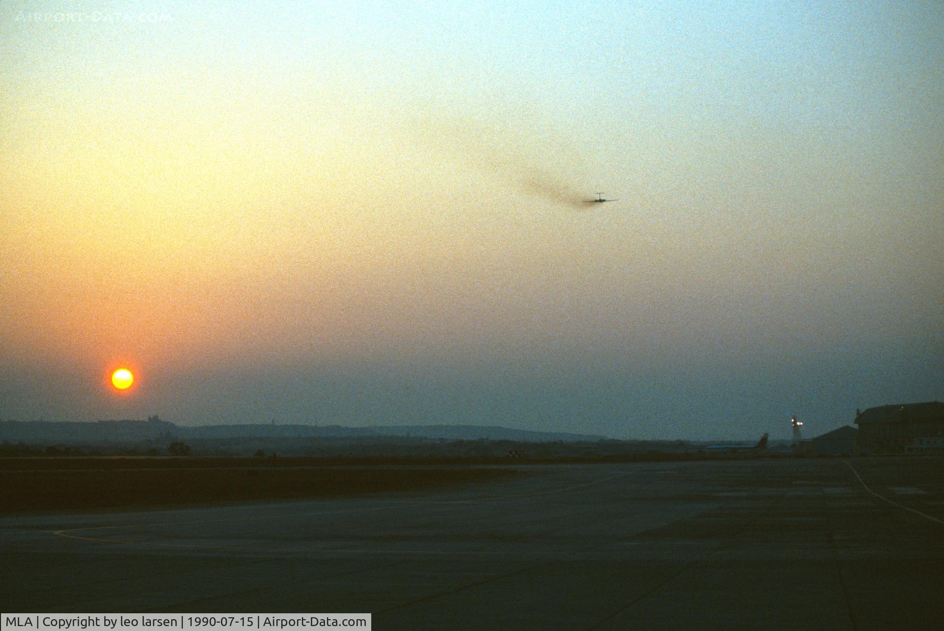 Malta International Airport (Luqa Airport), Luqa Malta (MLA) - Malta 15.7.90 Sunset dep.IL-62M DDR-SEM
