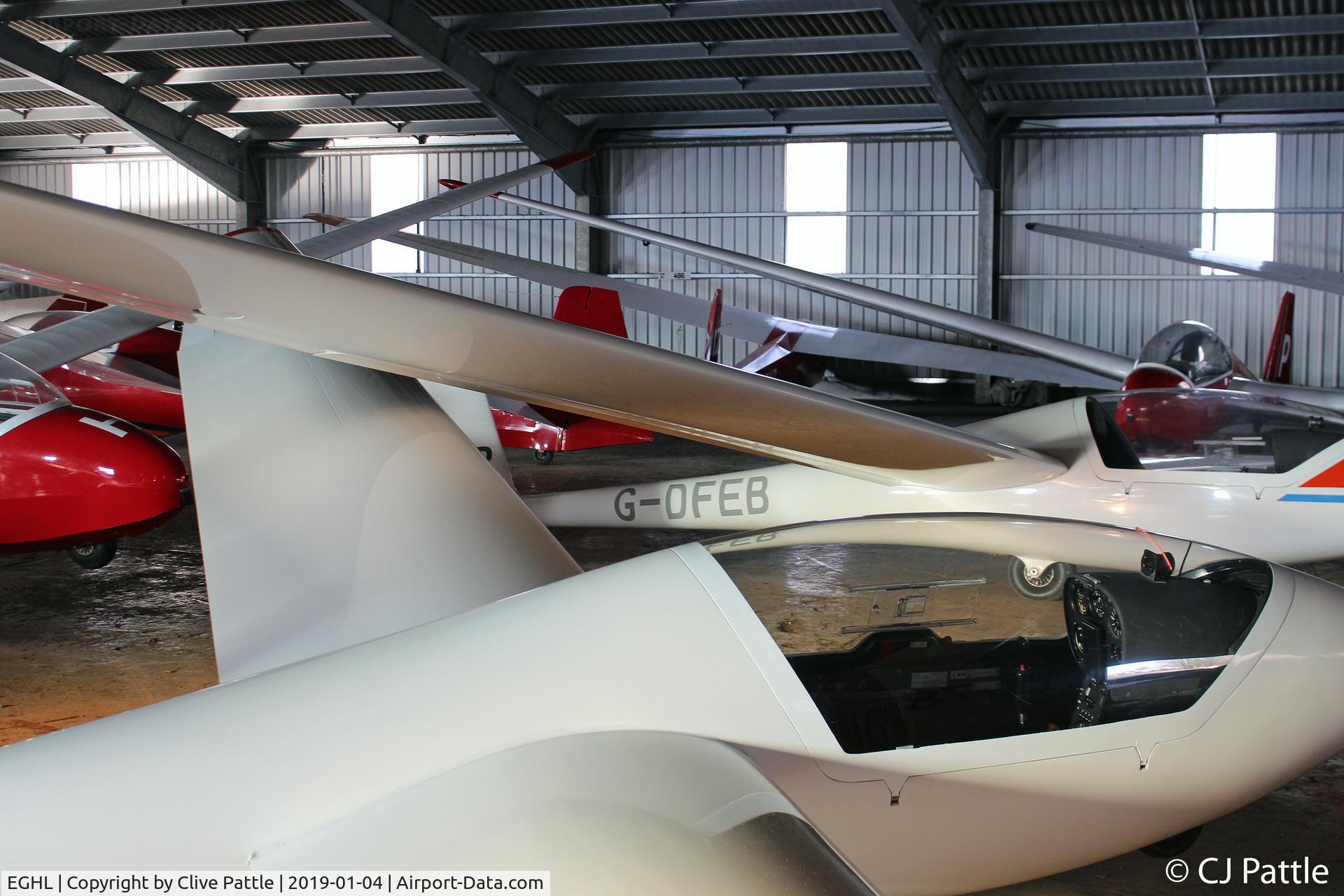 Lasham Airfield Airport, Basingstoke, England United Kingdom (EGHL) - Crowded hangar @ Lasham, Hants.