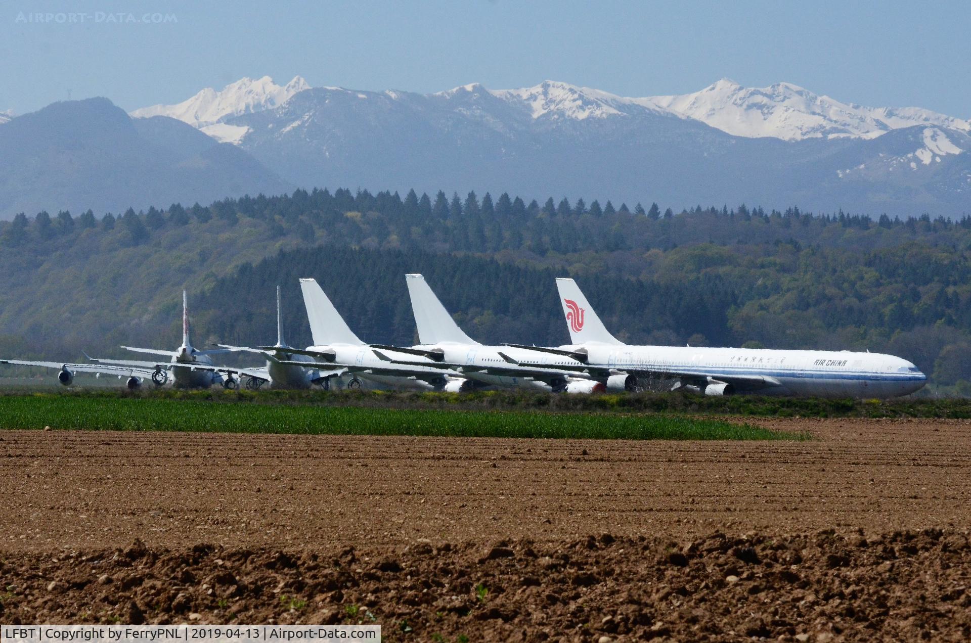 Tarbes Airport, Lourdes Pyrenees Airport France (LFBT) - Tarbes Airport storage with the snow capped Pyrenees in the background