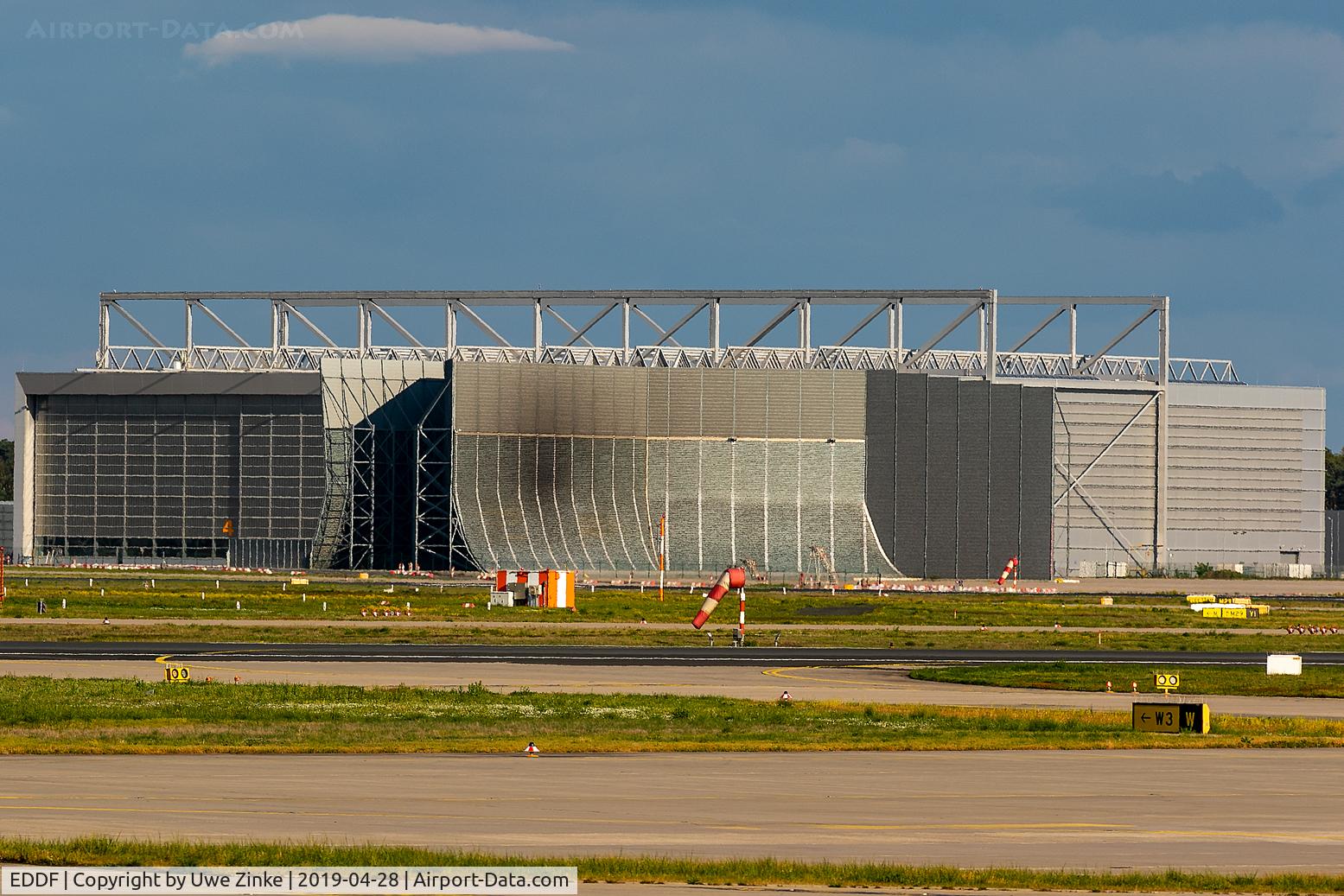 Frankfurt International Airport, Frankfurt am Main Germany (EDDF) - A 380 maintenance building.
The dark spot is from a MD 11 engine test!