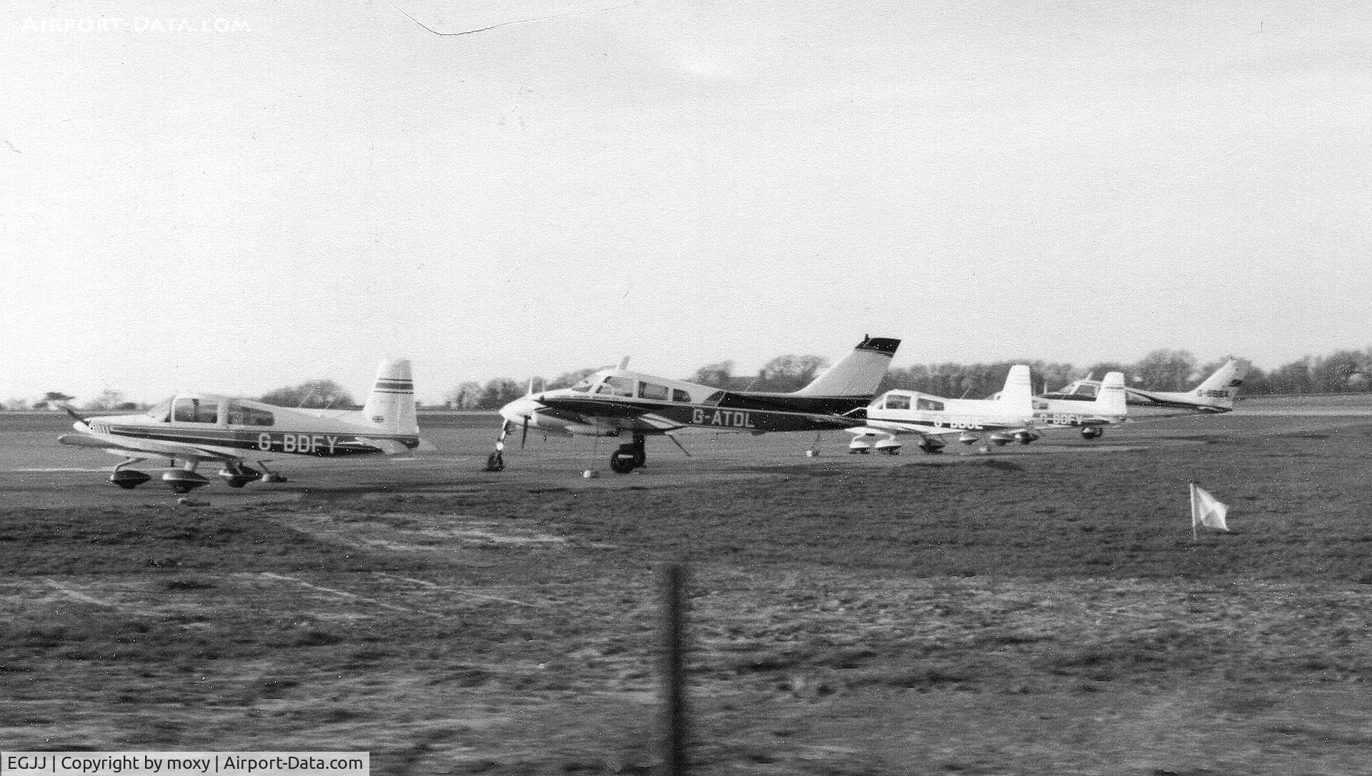Jersey Airport, Jersey, Channel Islands United Kingdom (EGJJ) - GA ramp at Jersey, Channel Islands, late 1970s. Scanned from poor negative.