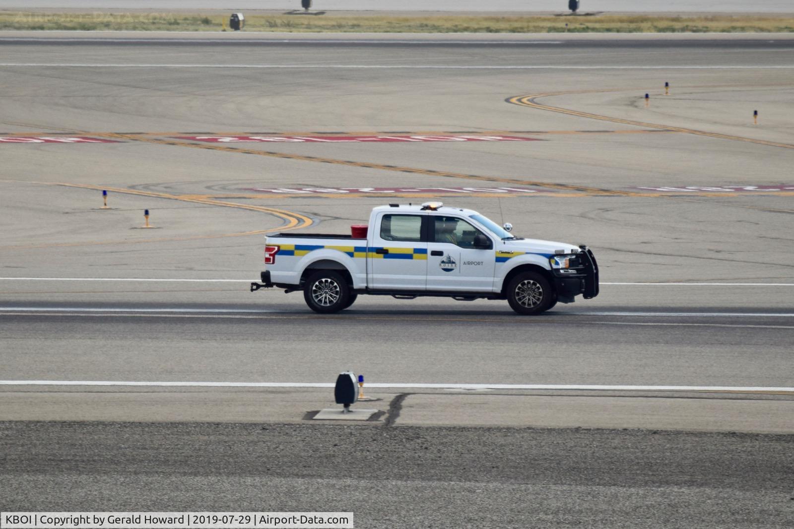 Boise Air Terminal/gowen Fld Airport (BOI) - OPS truck doing a runway check for FOD after a C-5M took off.