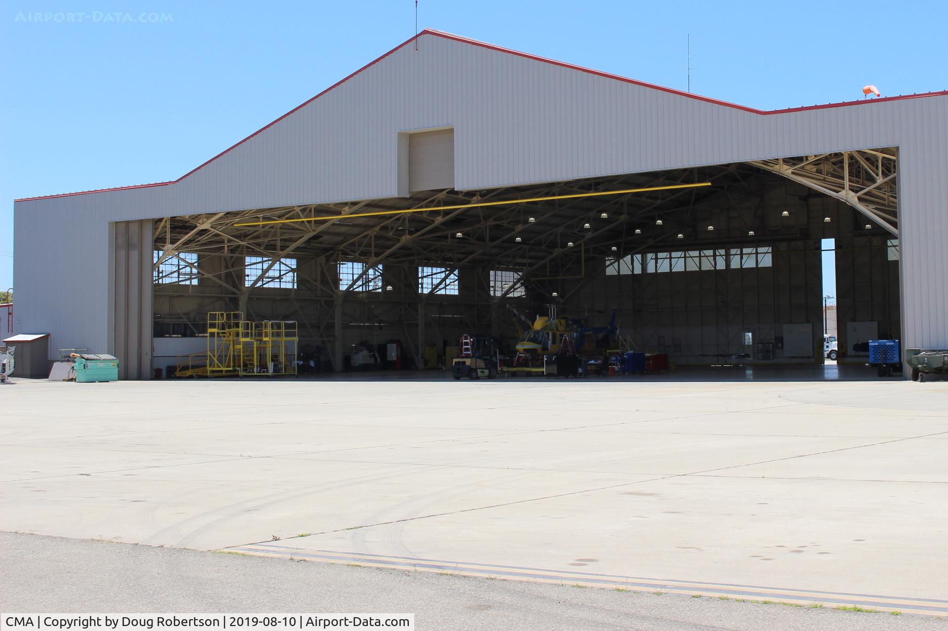 Camarillo Airport (CMA) - Another view of the Ventura County Fire Department Helicopter Unit that has now taken over the entire hangar and added foreground ramp. Formerly just in west end & west ramp. Aircraft formerly on outside ramp relocated.