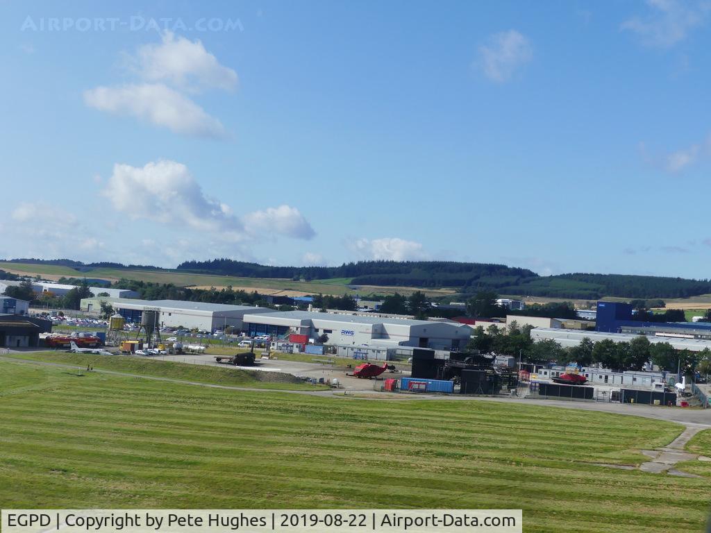 Aberdeen Airport, Aberdeen, Scotland United Kingdom (EGPD) - Fire training area at Aberdeen seen from SAAB 2000 G-LGNS on arrival.  Note the Jaguar and the Jetstream fuselage among the heavier training aids.