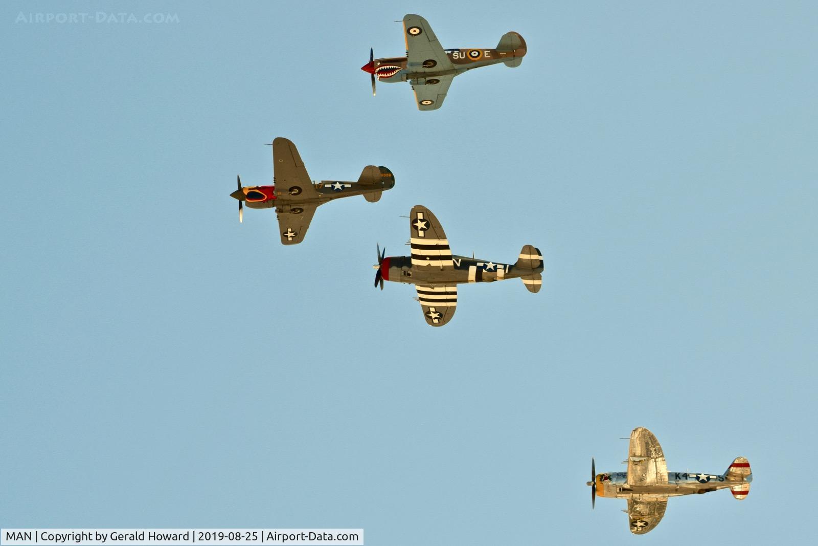 Nampa Municipal Airport (MAN) - P-40s and P-47s fly by at Nampa Air Show.
