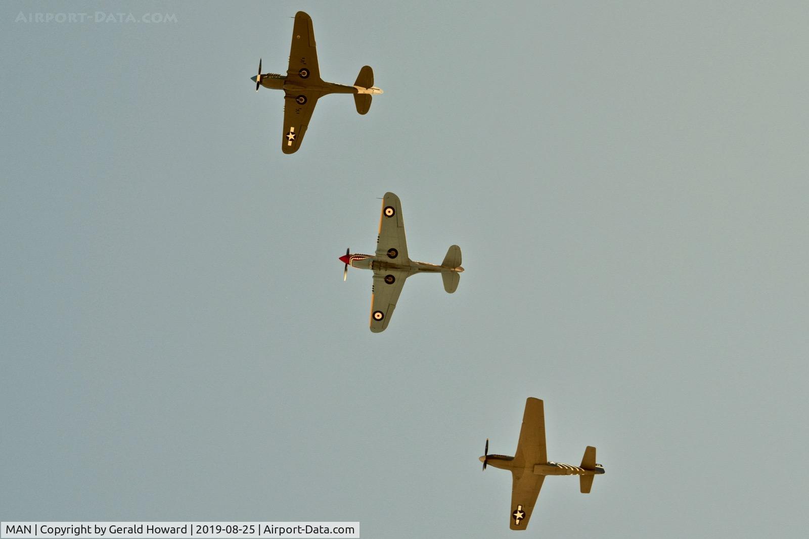 Nampa Municipal Airport (MAN) - P-40s and P-51 over fly MAN during airshow.