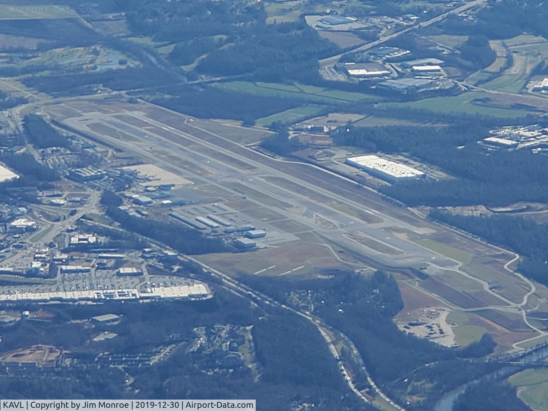 Asheville Regional Airport, From 10,000 feet MSL looking south. The FAA determined that the runway was too close to the taxiway. They built a whole new runway (west side), tore up the old runway and built a new one (in the center). This has been in process several years.