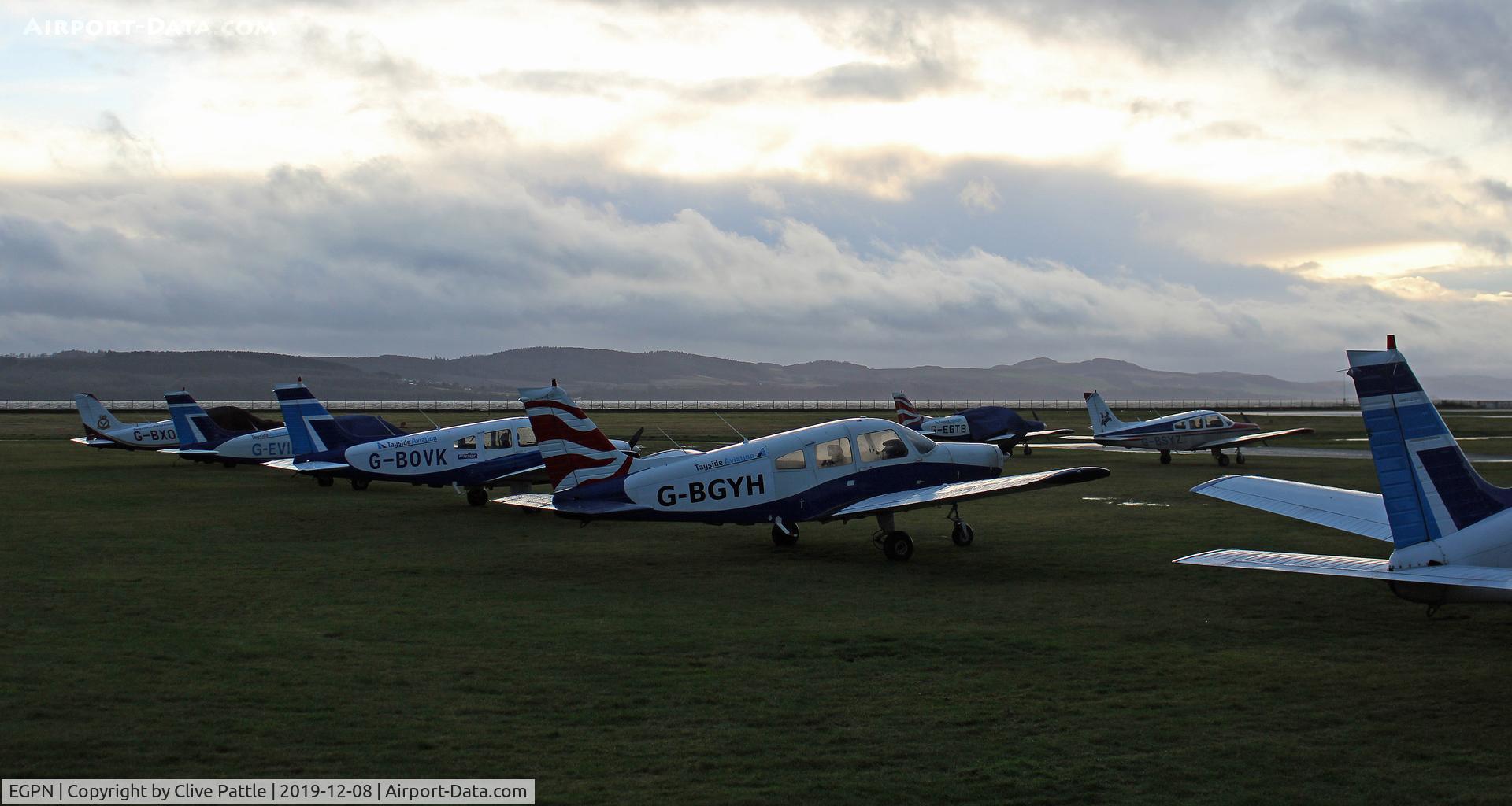 Dundee Airport, Dundee, Scotland United Kingdom (EGPN) - Sunset line-up of Tayside Aviation trainers