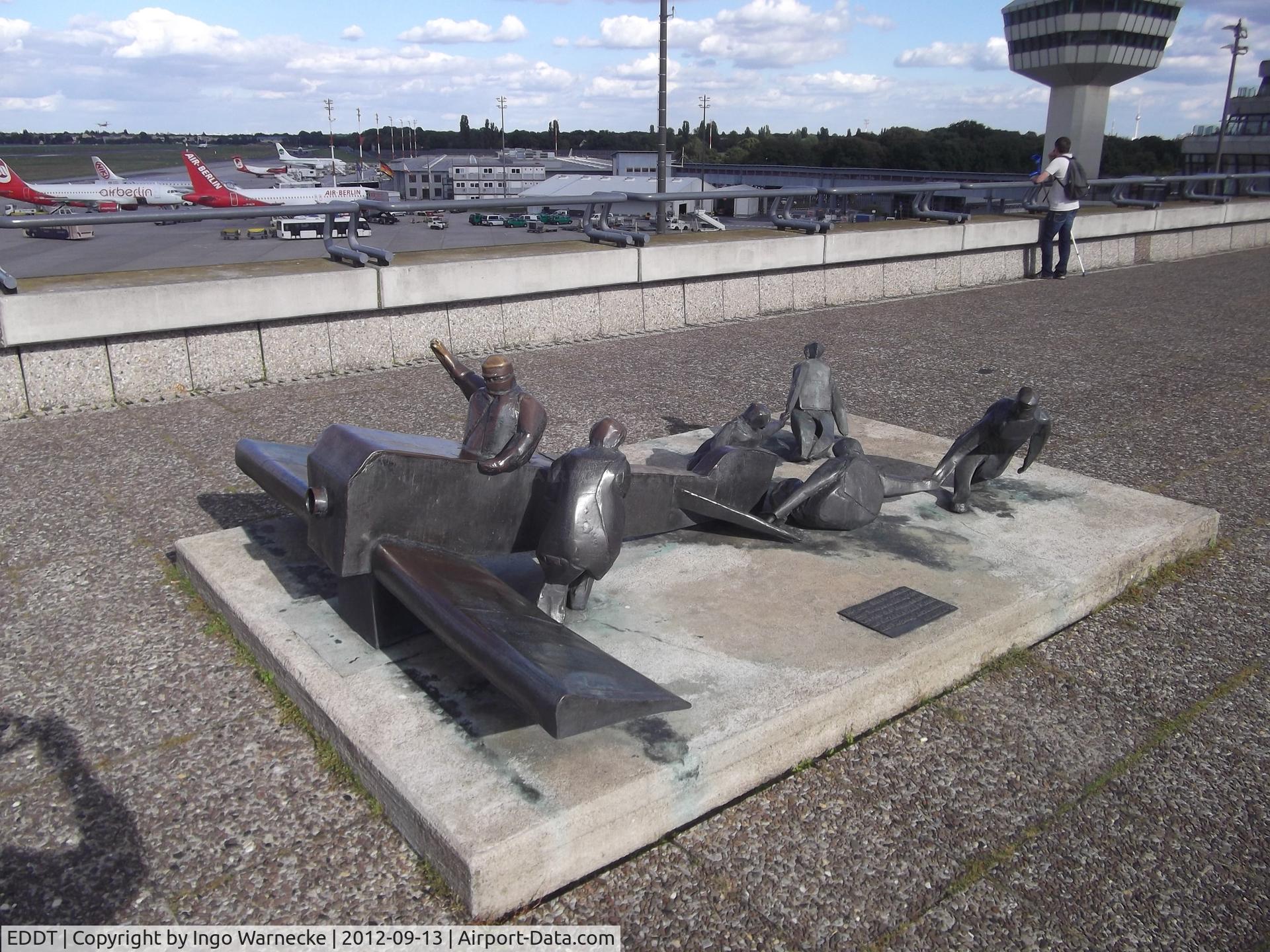 Tegel International Airport (closing in 2011), Berlin Germany (EDDT) - sculpture 'Vor dem Start in Calais zum Europarundflug 1911 wartet die Mannschaft auf ein Zeichen des Piloten, das Flugzeug loszulassen' 1983 by K. Biederbick on the viewing platform at Berlin-Tegel (now at BER)