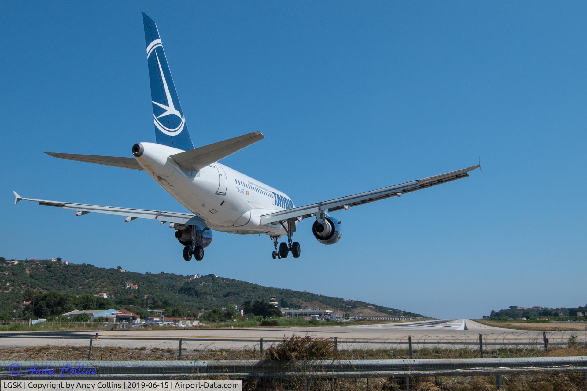 Skiathos Island National Airport, Skiathos Greece (LGSK) - Tarom Airbus 318 landing at Skiathos Airport.