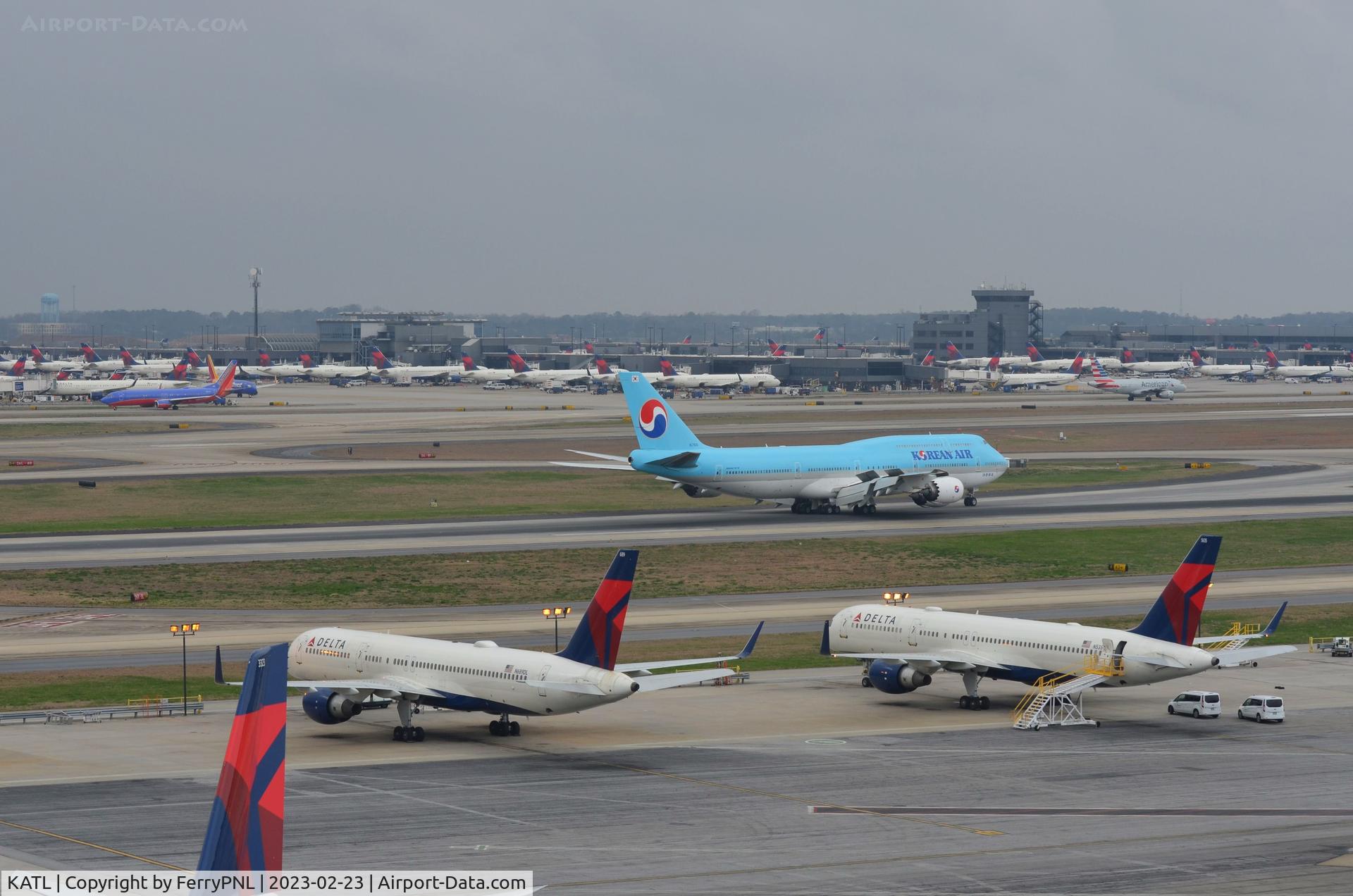 Hartsfield - Jackson Atlanta International Airport (ATL) - ATL runway 26 in use with terminals B & C in the background