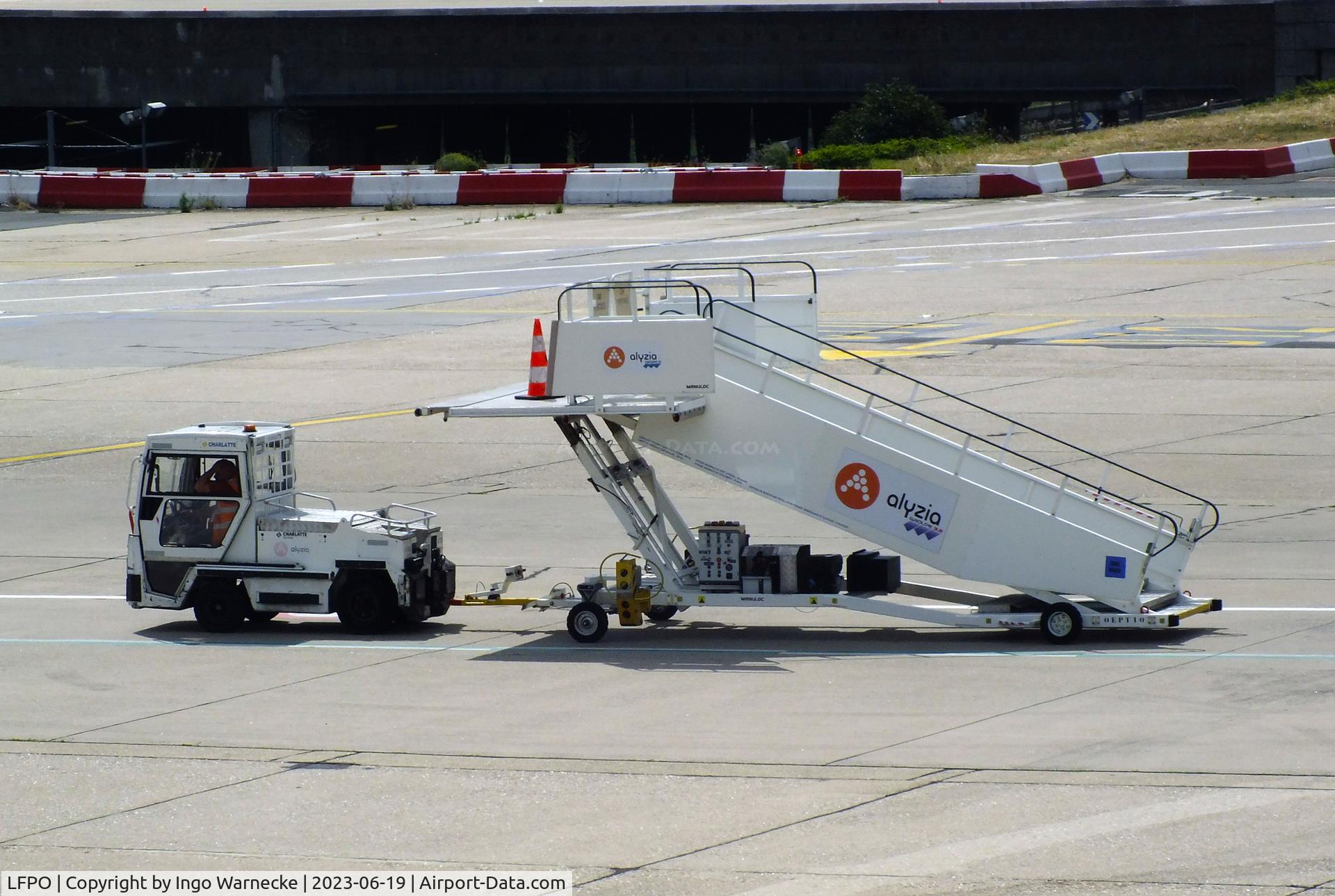 Paris Orly Airport, Orly (near Paris) France (LFPO) - open boarding stairs being towed at Paris/Orly airport #v