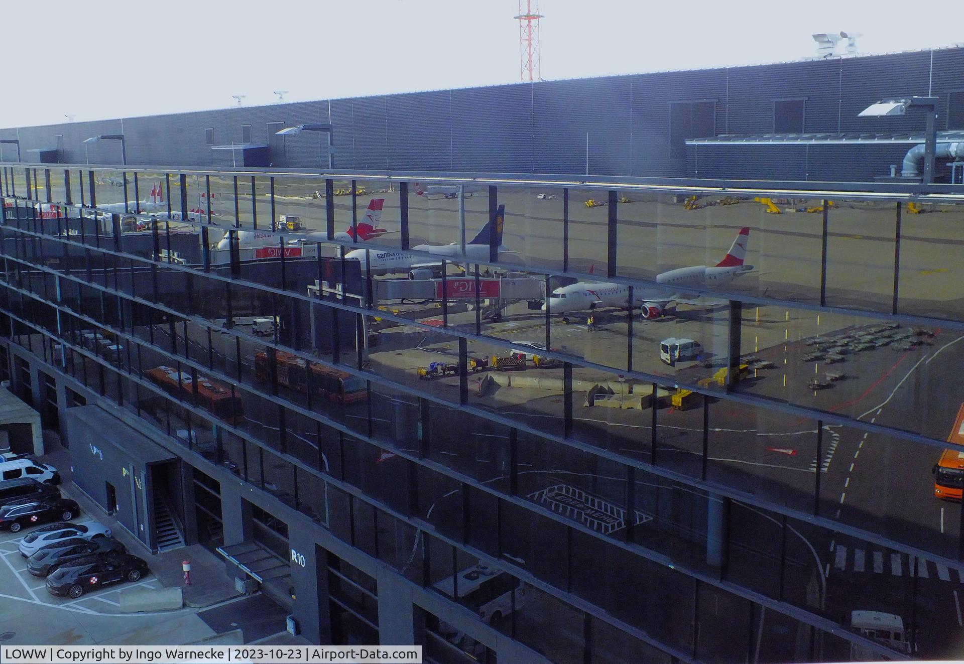 Vienna International Airport, Vienna Austria (LOWW) - apron reflected in the facade on northern side of gates building F/G at the eastern end of terminal 3 at Wien airport