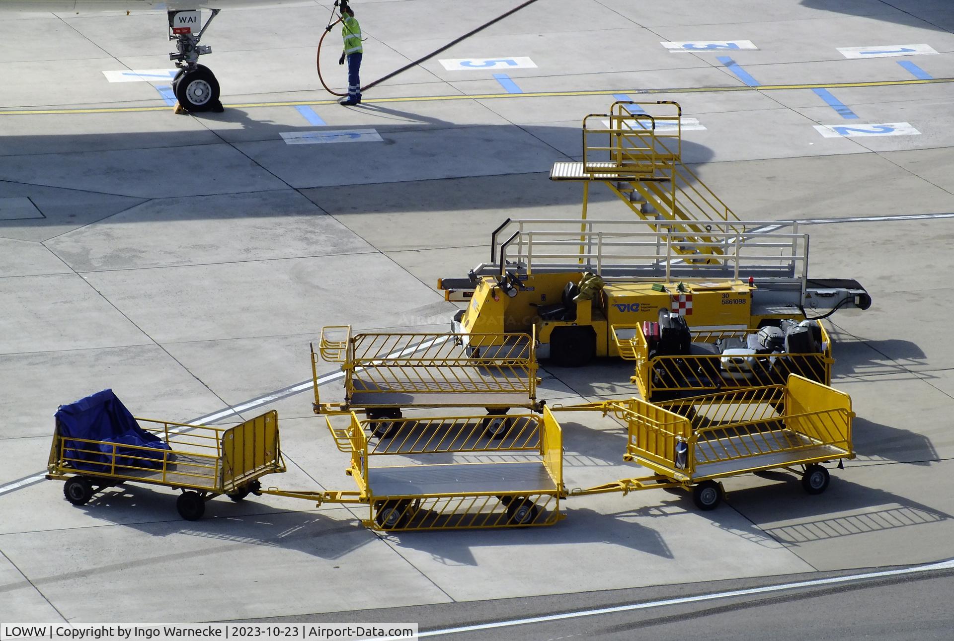 Vienna International Airport, Vienna Austria (LOWW) - empty baggage train and loading vehicle at Wien airport #v