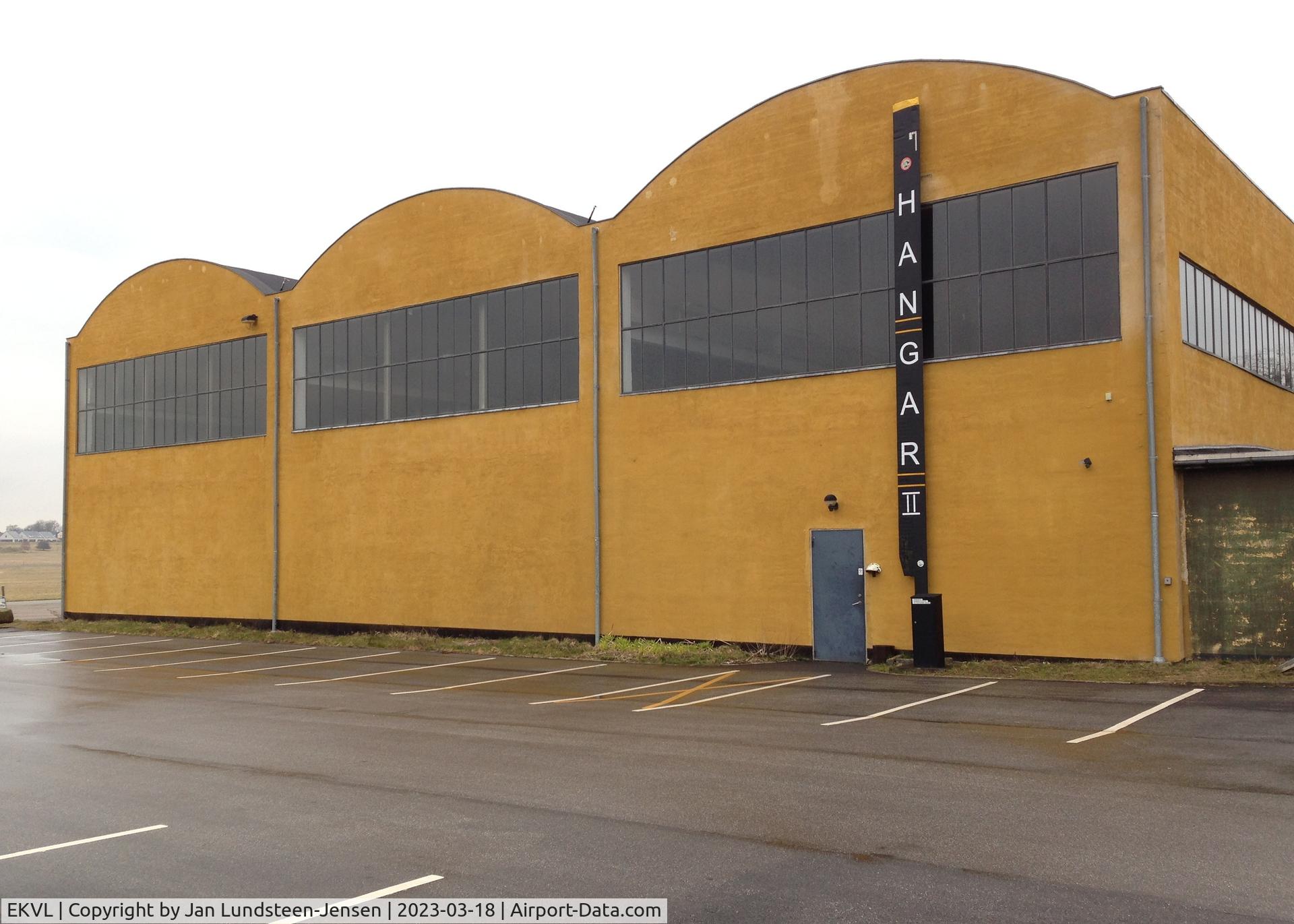 EKVL Airport - Hangar 2, the historical aircraft hangar at the former Vaerloese Air Base in Denmark. The hangar was built in 1937. The hangar sign is a Sikorsky S-61 main rotor blade. The hangar was the home of the Danish AF S-61s 1965-2004.