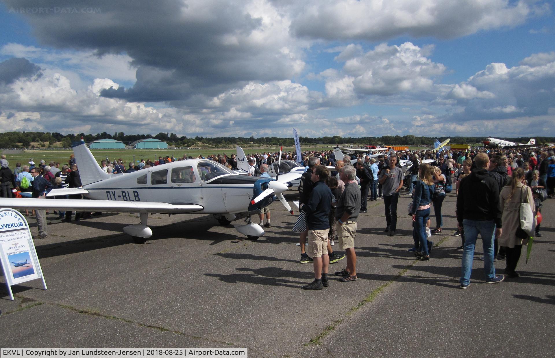 EKVL Airport - An airshow at the former Vaerloese Air Base in Denmark. To the left Piper PA-28 OY-BLB and in the background to the right Douglas C-47A OY-BPB.