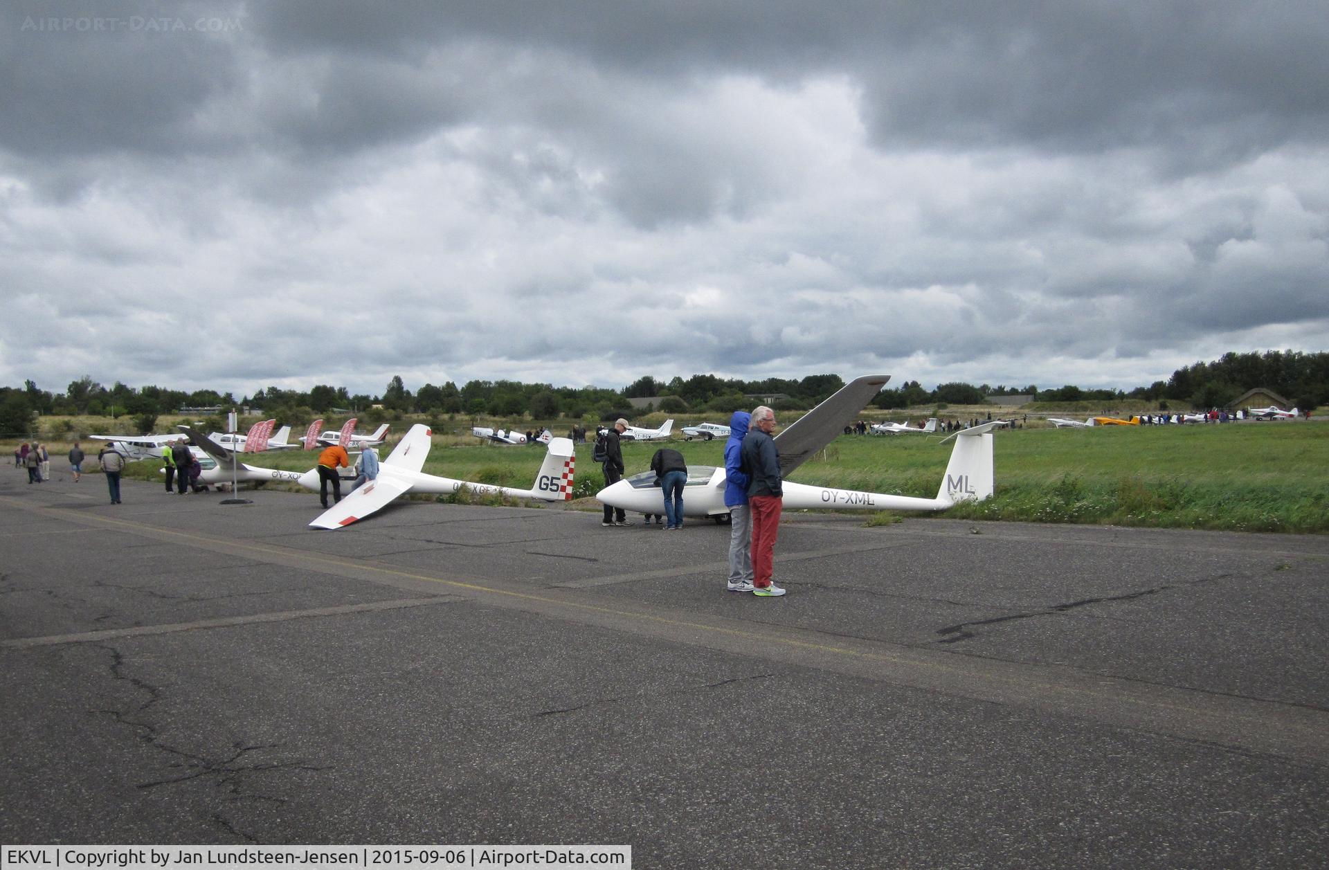 EKVL Airport - An airshow at the former Vaerloese Air Base in Denmark. Closest to camera is the glider Rolladen-Schneider LS4 OY-XML.