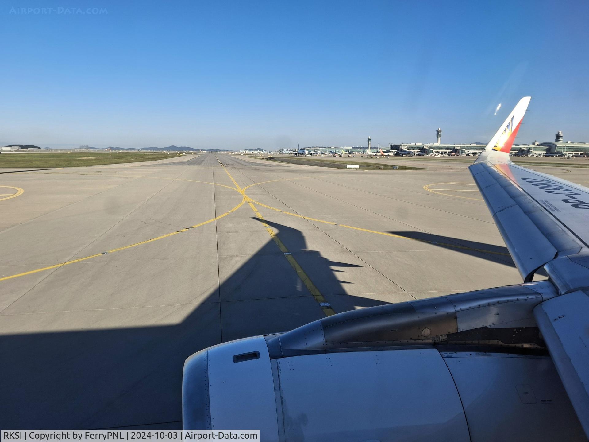 Incheon International Airport, Incheon (near Seoul) Korea, Republic of (RKSI) - ICN terminal on the right while lining up for departure