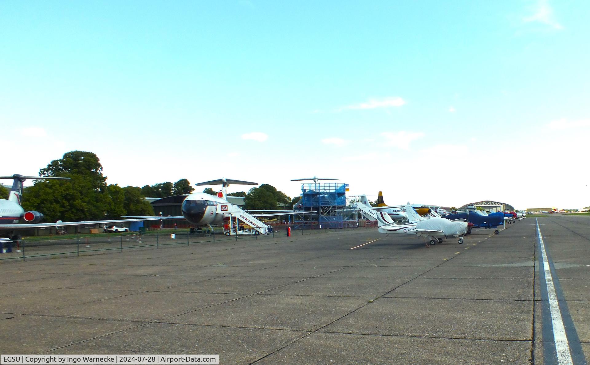 Duxford Airport, Cambridge, England United Kingdom (EGSU) - parked aircraft on apron and museum airliners at Duxford airfield