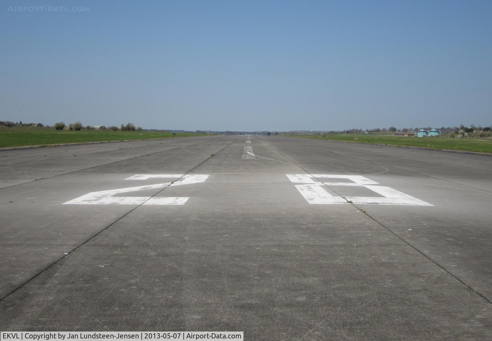 EKVL Airport - Runway 28 at the abandoned Vaerloese Air Base in Denmark. The Air Base opened as a grass airfield in 1934. The concrete runway was built in 1952-1953. Vaerloese Air Base closed in 2004.