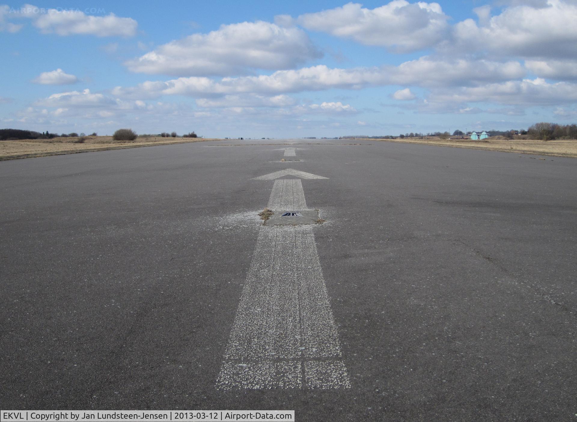EKVL Airport - Arrows pointing to the displaced threshold of Runway 28 at the closed Vaerloese Air Base in Denmark.