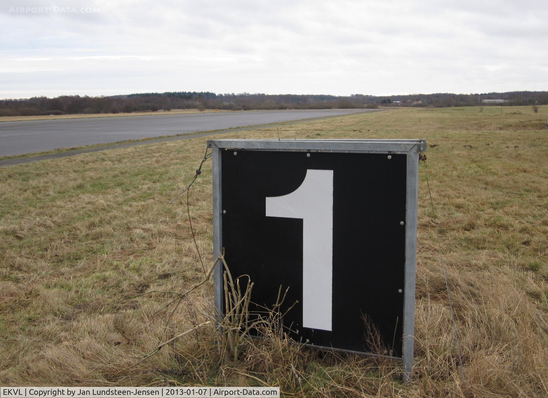 EKVL Airport - A 1000 feet remaining to end of Runway 10 sign at the closed Vaerloese Air Base in Denmark. The sign was removed some months later.