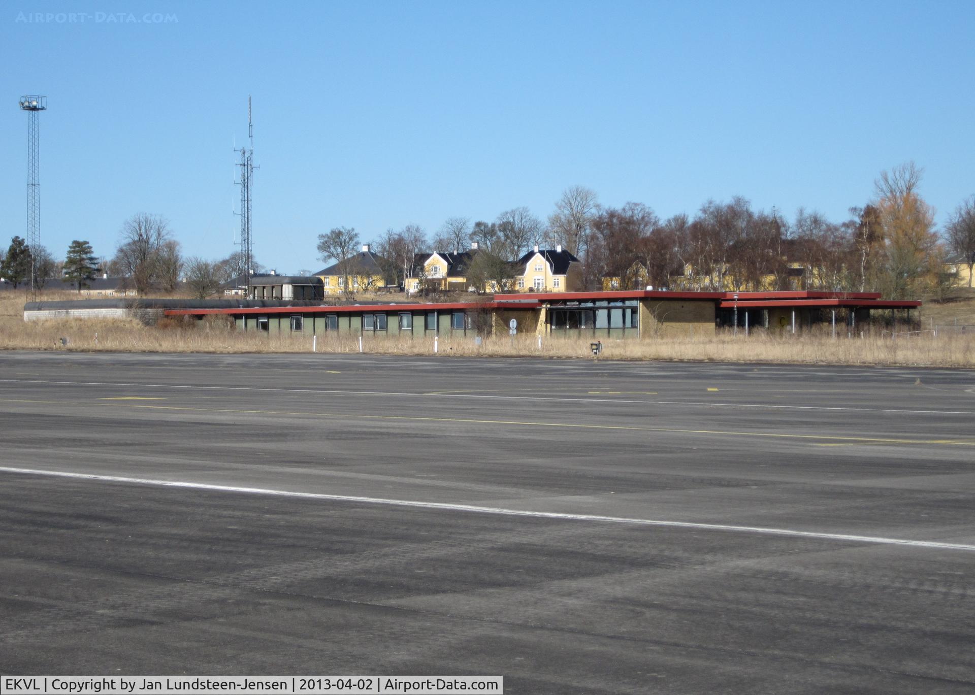 EKVL Airport - The Terminal at the closed Vaerloese Air Base in Denmark. The terminal was built in 1977/1979 and was demolished a few years after the photo was taken. The dark/light grey operations bunker to the left remained.
