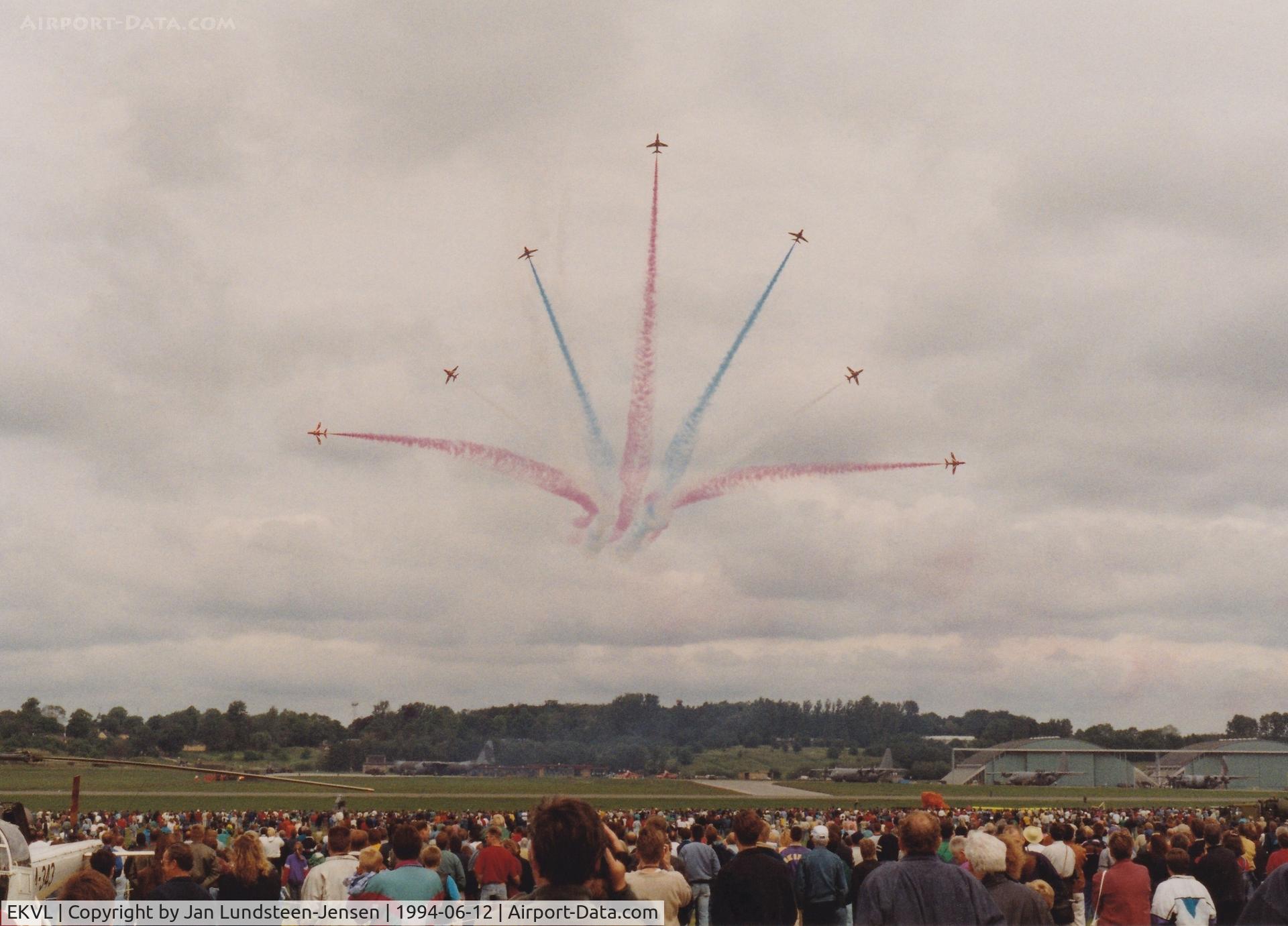 EKVL Airport - RAF Red Arrows performing the Vixen Break at Vaerloese Air Base Open House 1994 in Denmark. In the background 2 spare Red Arrows Hawks and 4 C-130s.