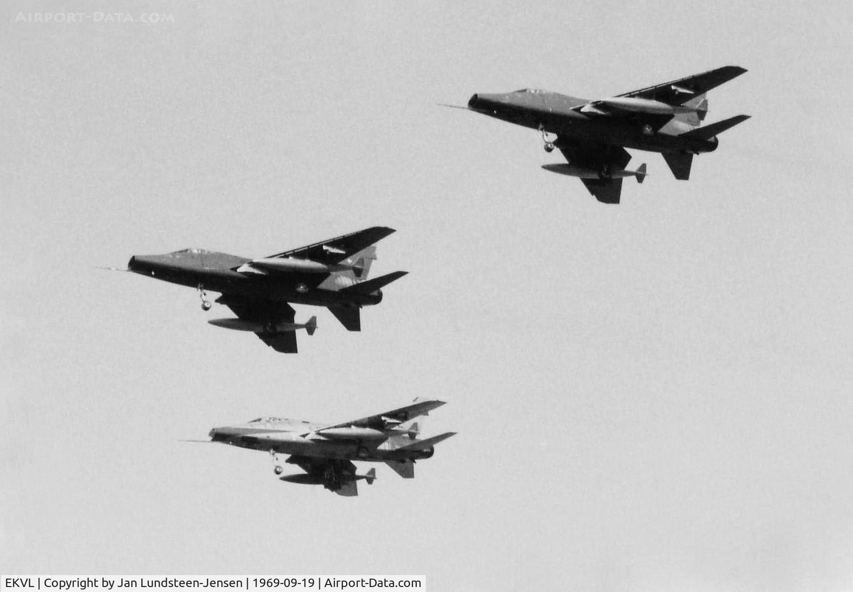 EKVL Airport - 3 Danish Air Force F-100Ds seen on final approach to Runway 28 at Vaerloese Air Base in Denmark in 1969. 2 in green paint scheme. 3rd plane still in natural metal finish with red nose.