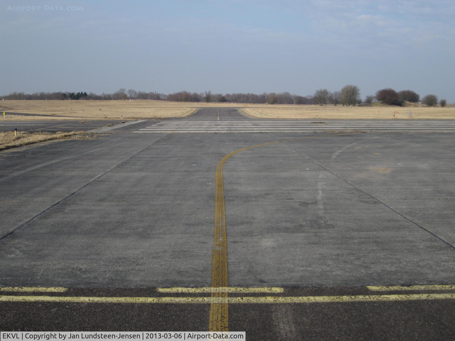 EKVL Airport - Runway 10 Holding Position on Taxiway Echo South in the western part of the closed Vaerloese Air Base in Denmark. The air base closed in April 2004 and became a civilian area in October 2013.