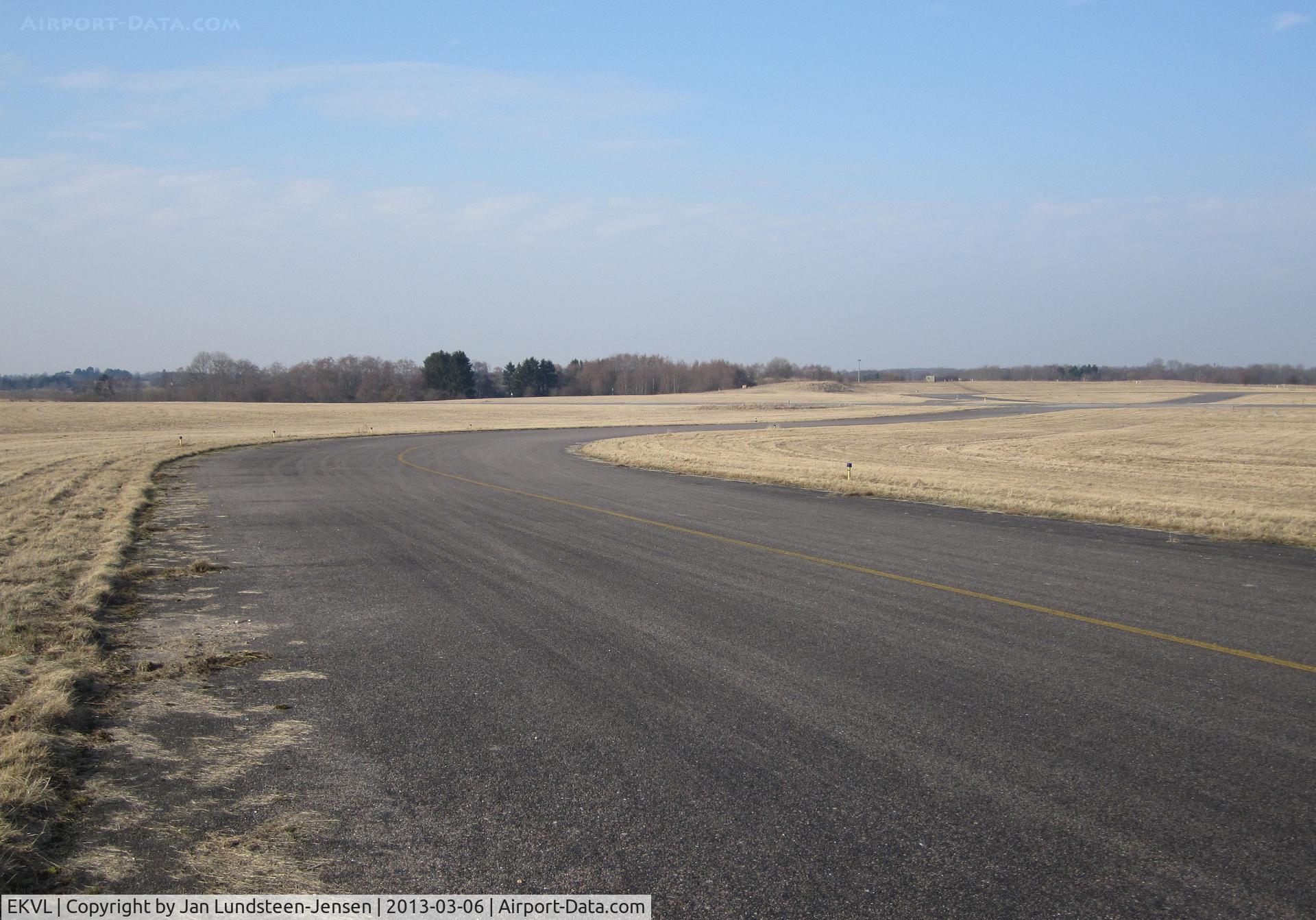 EKVL Airport - Taxiway Echo South seen towards the runway in the western part of the closed Vaerloese Air Base in Denmark.