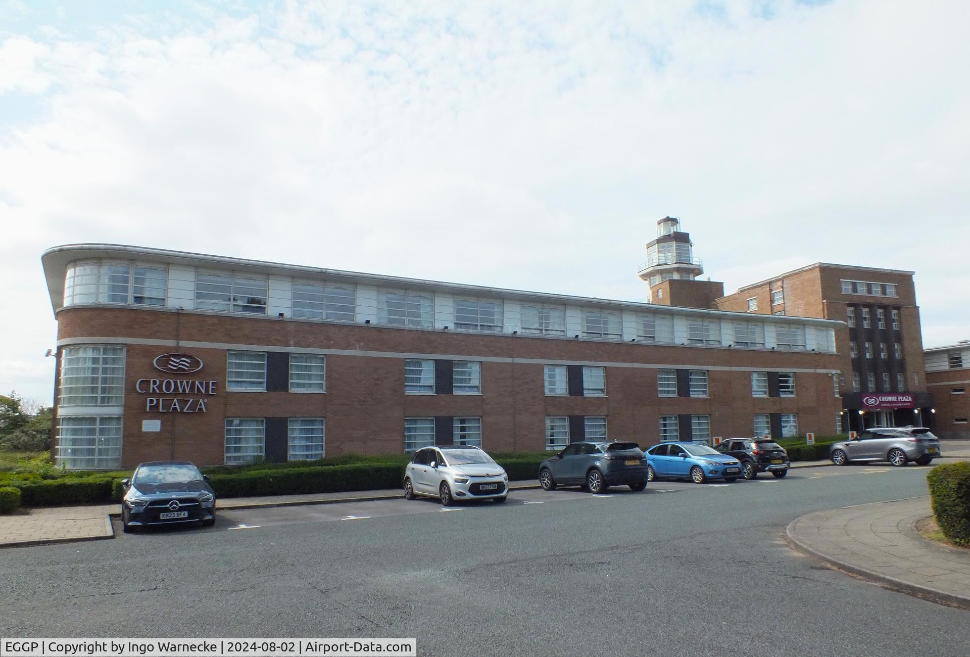 Liverpool John Lennon Airport, Liverpool, England United Kingdom (EGGP) - landside view of the old 1930s terminal and tower (today a Crowne Plaza hotel) with exhibition of vehicles and aircraft preserved by the Speke Aerodrome Heritage Groups (SAHG) on the former apron 