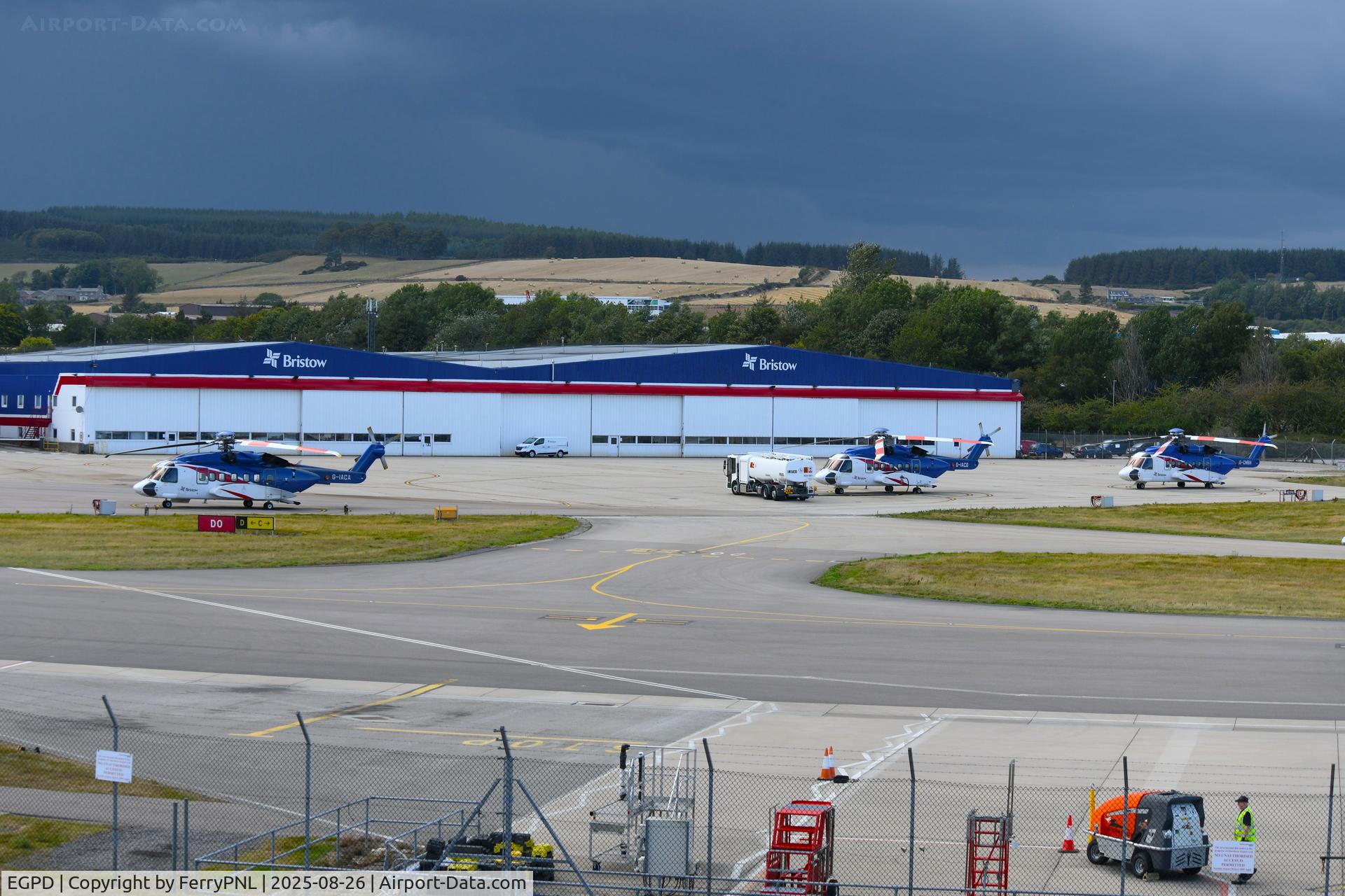 Aberdeen Airport, Aberdeen, Scotland United Kingdom (EGPD) - Bristow hangars at ABZ with a thunderstorm moving in