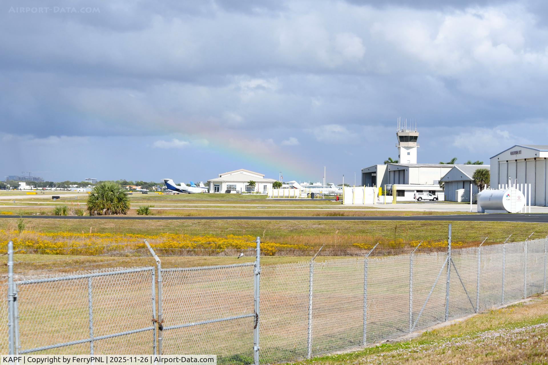 Naples Municipal Airport (APF) - View over APF from the viewing area, including a rainbow.
