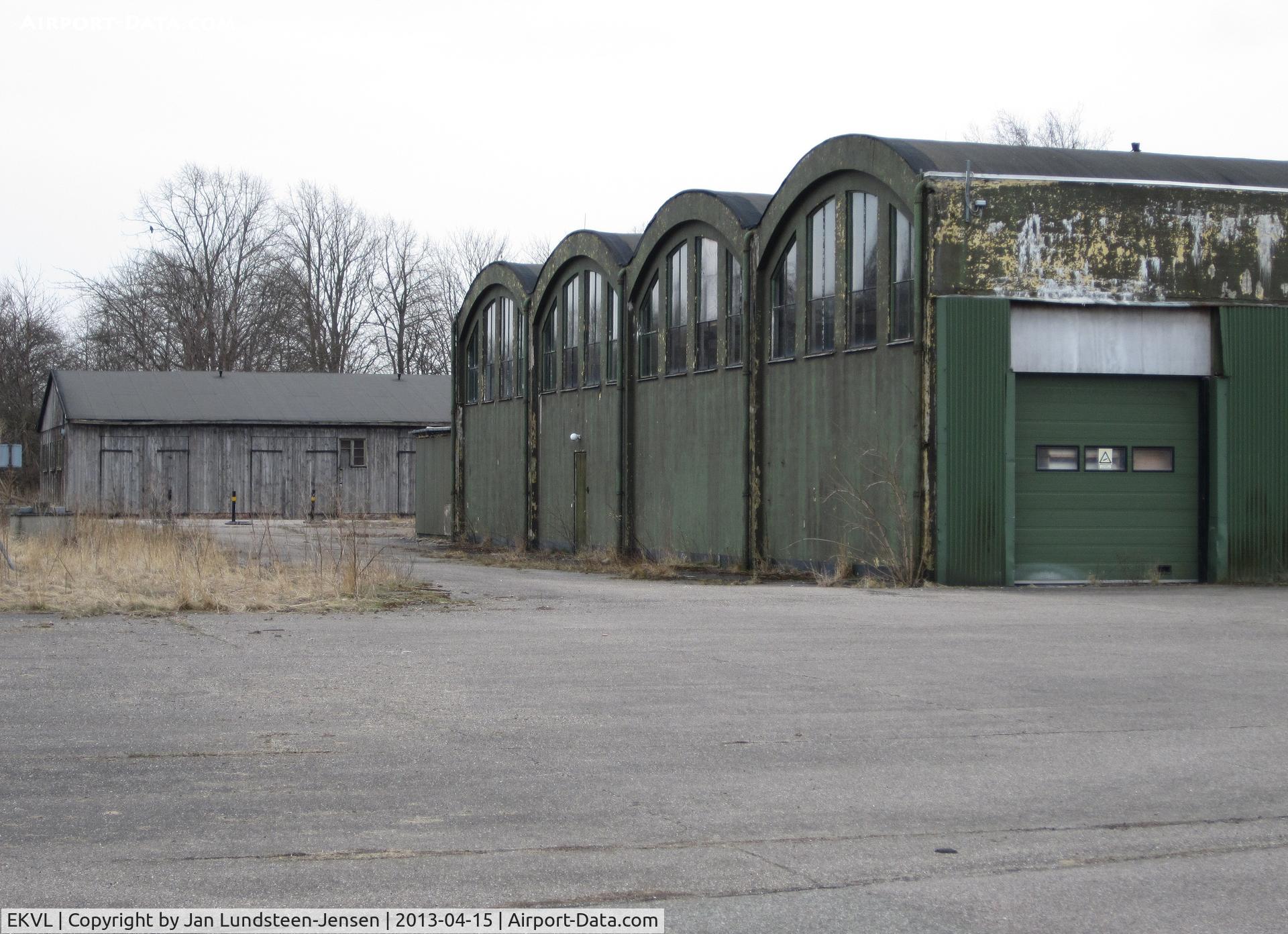 EKVL Airport - The eastern part of Hangar 3 at the closed Vaerloese Air Base in Denmark. The hangar was built in 1936. The wooden storage building in the background was built by the German occupation forces in 1941 and was demolished after the photo was taken.