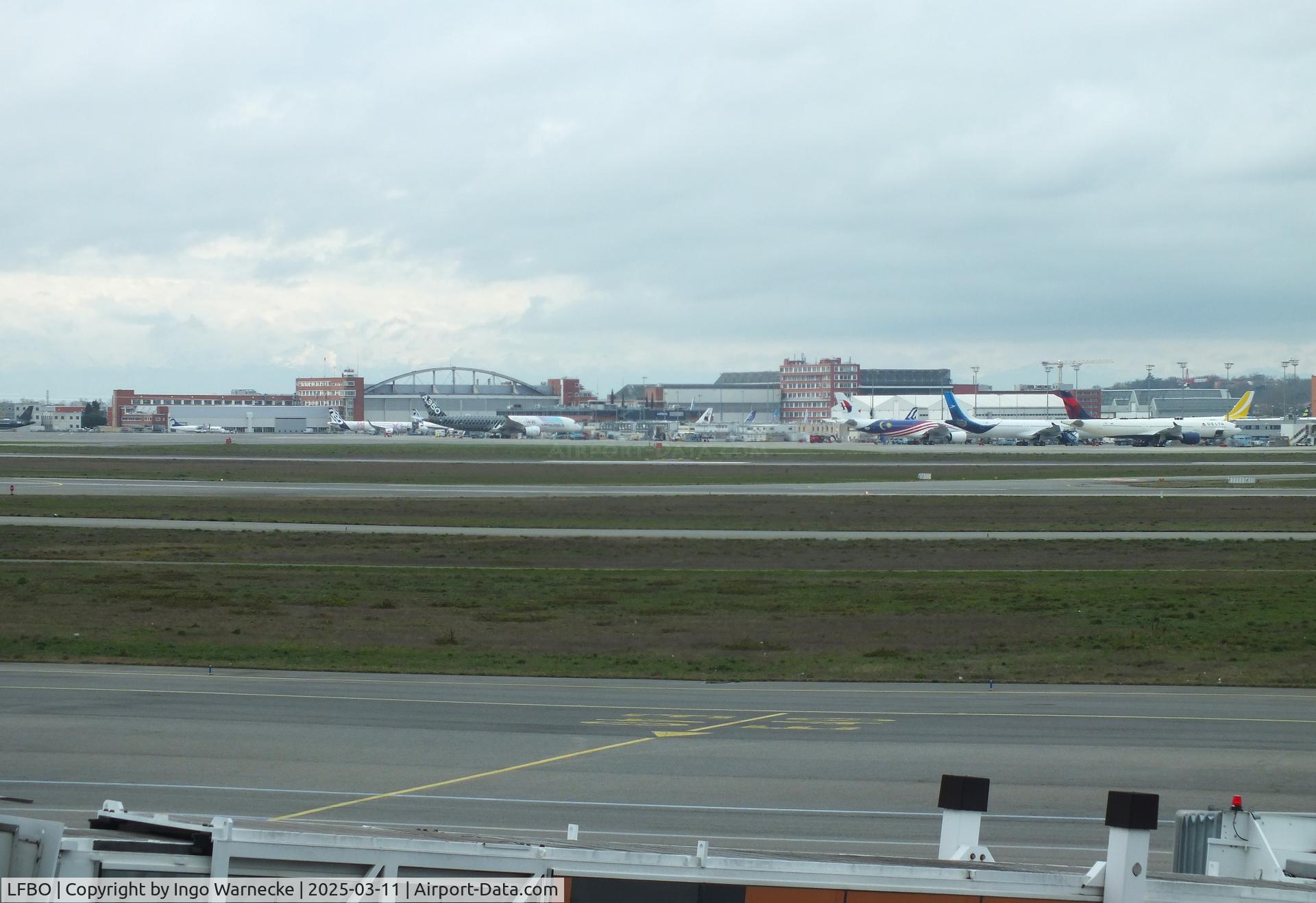 Toulouse Airport, Blagnac Airport France (LFBO) - looking from the terminal across apron / runways towards the Airbus facilities at Toulouse-Blagnac airport