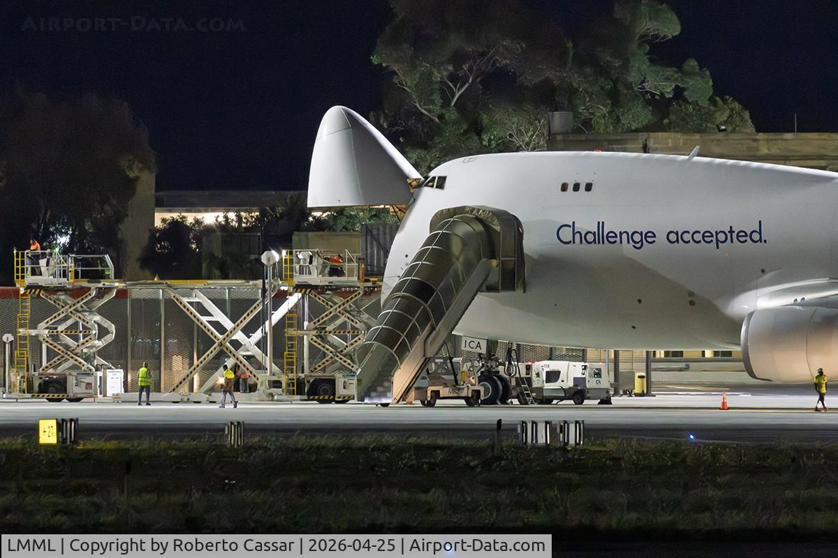 Malta International Airport (Luqa Airport), Luqa Malta (LMML) - Challenge Airlines '4X-ICA' offloading heavy cargo in Malta late at night. Note the use of the nose door.